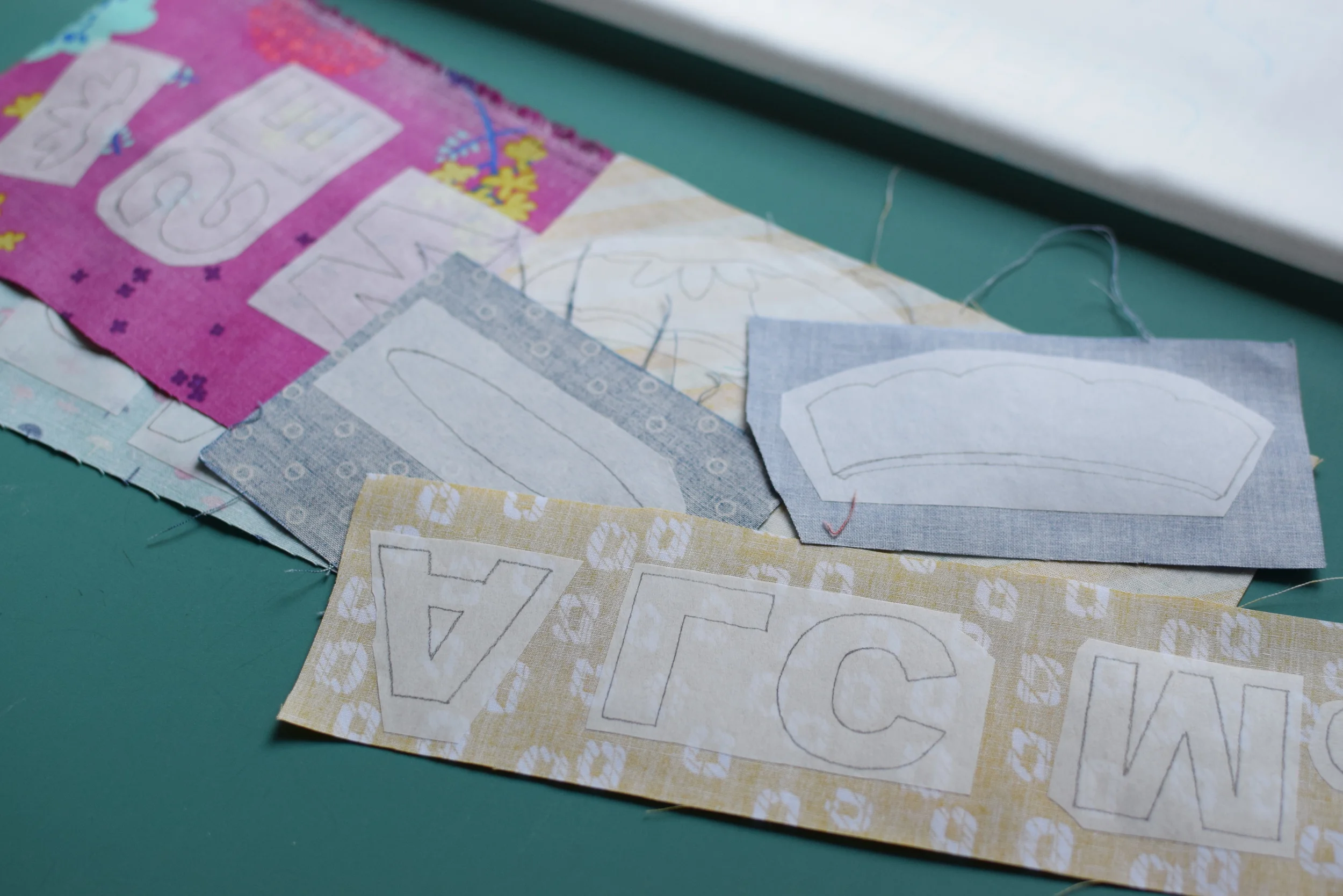 Note the 1/8" overlapping allowance I put on the pin cushion top and side-face fusible pieces. The cushion bottom piece does not require any overlapping allowance because in my plan it would be the last piece to be ironed onto the background fabric and nothing else would be put on top of it. 