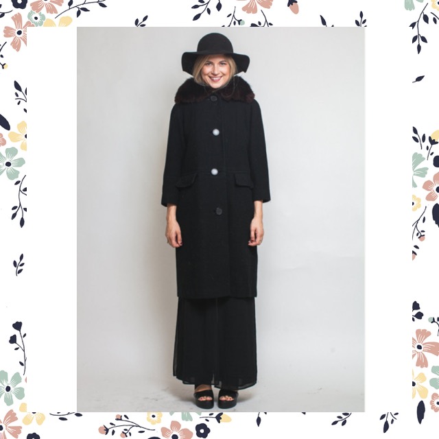  How beautiful is this amazing, simple, and chic black coat? It even has a fur collar. Find it here .