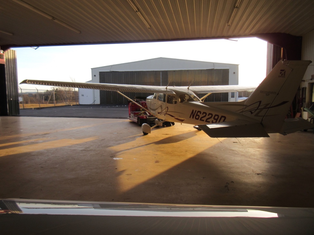  Putting the plane in the hangar (NOT a hanger) overnight. I like the lighting in this shot 