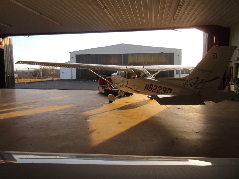  Putting the plane in the hangar (NOT a hanger) overnight. I like the lighting in this shot 