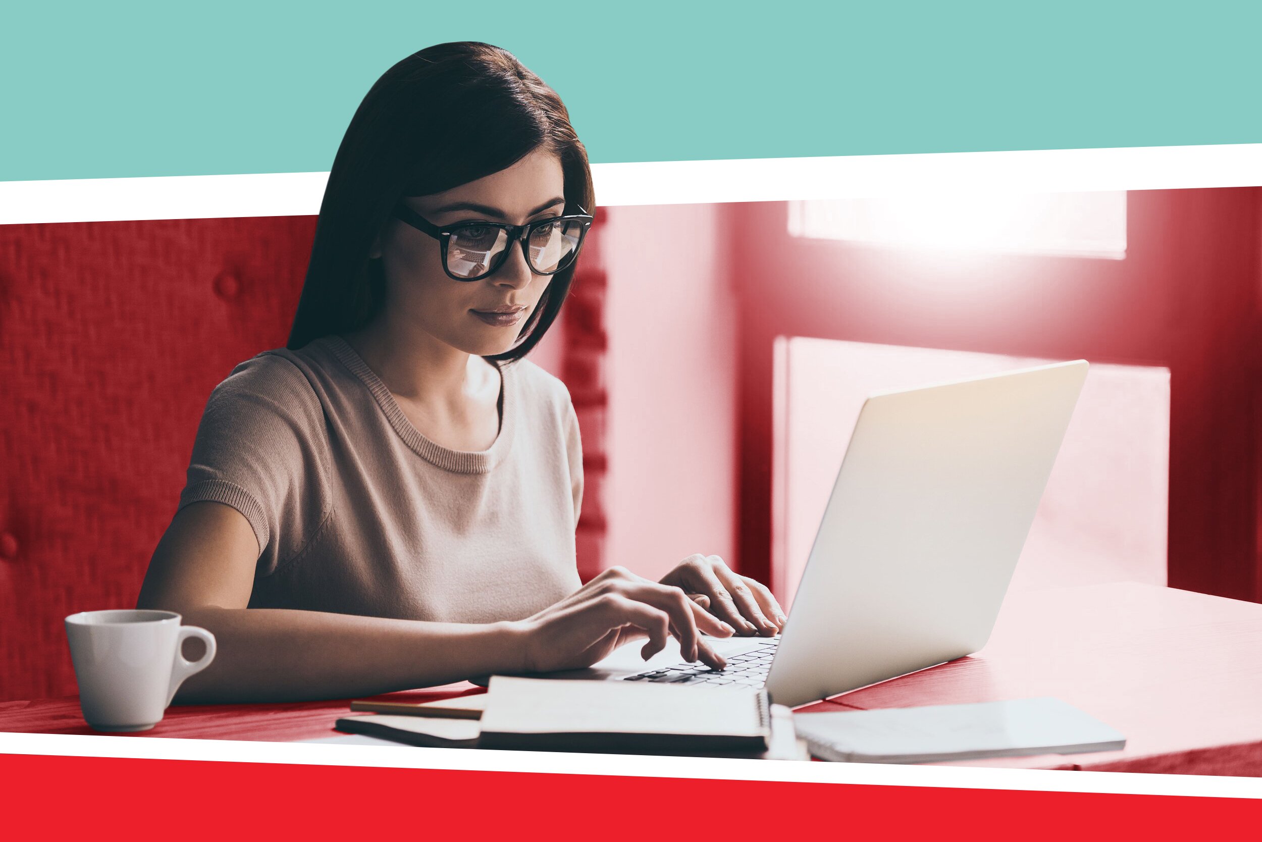 A student wearing glasses and writing a research assistant cover letter