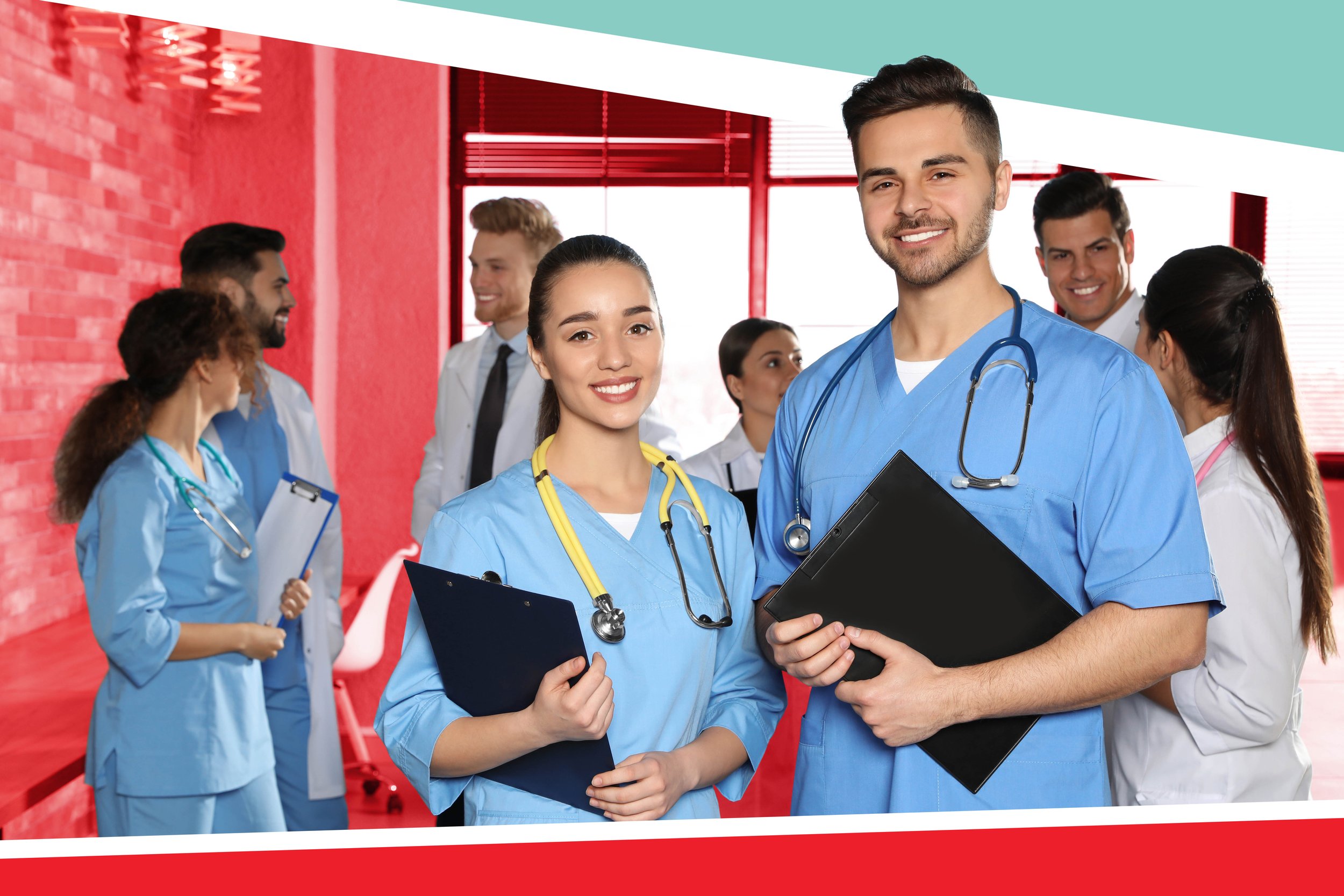 2 smiling medical school students wearing blue scrubs standing in front of a group of chatting doctors