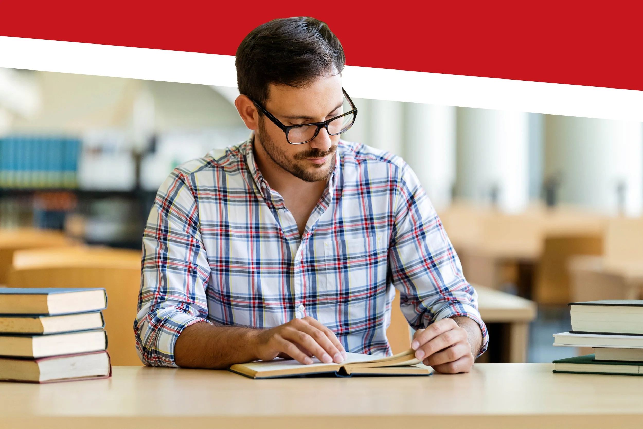 a man sitting at a desk utilizing usmle prep books