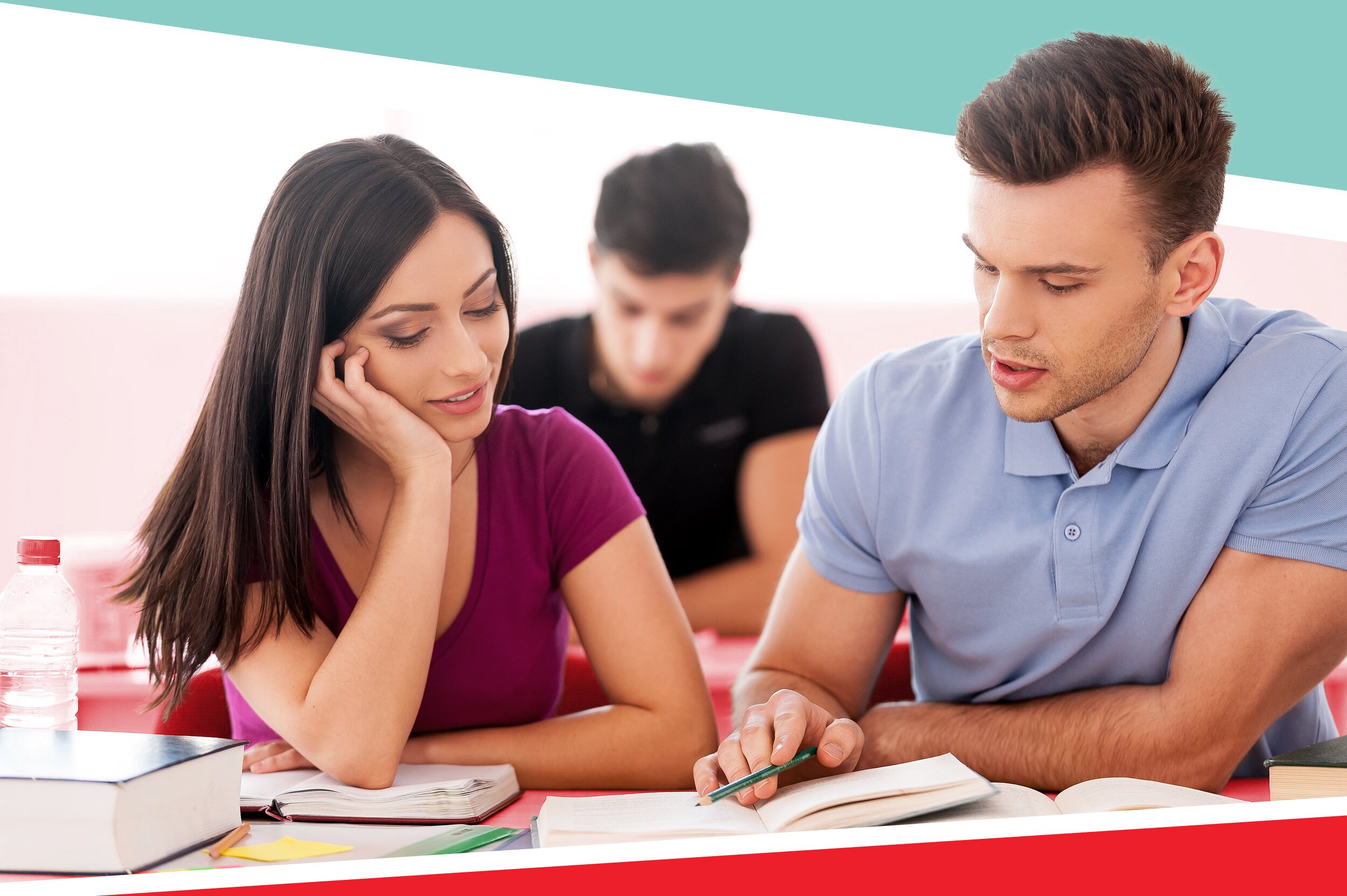 Two students working on supplemental college essays at a library