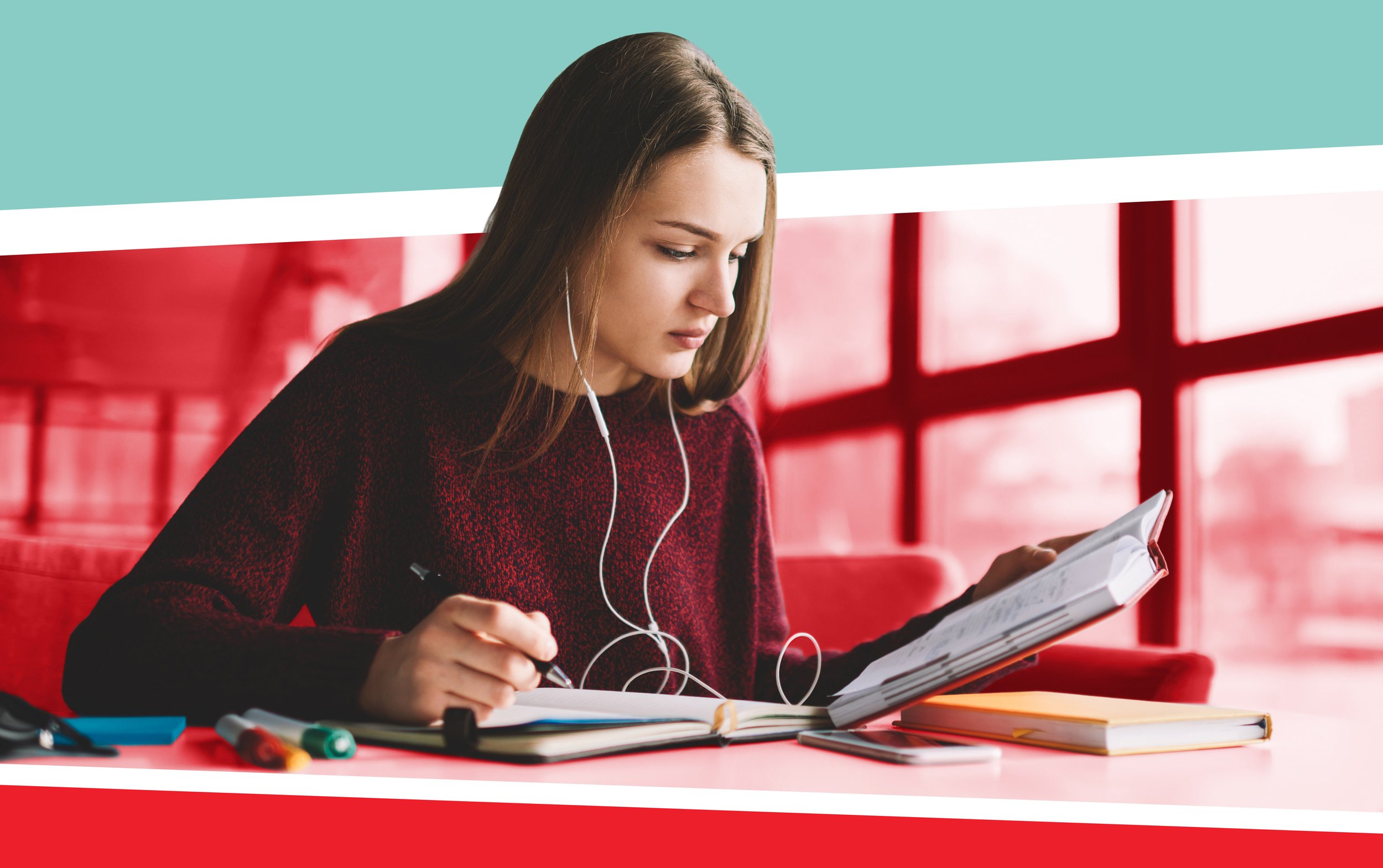 College student using earbuds to listen to audiobook.