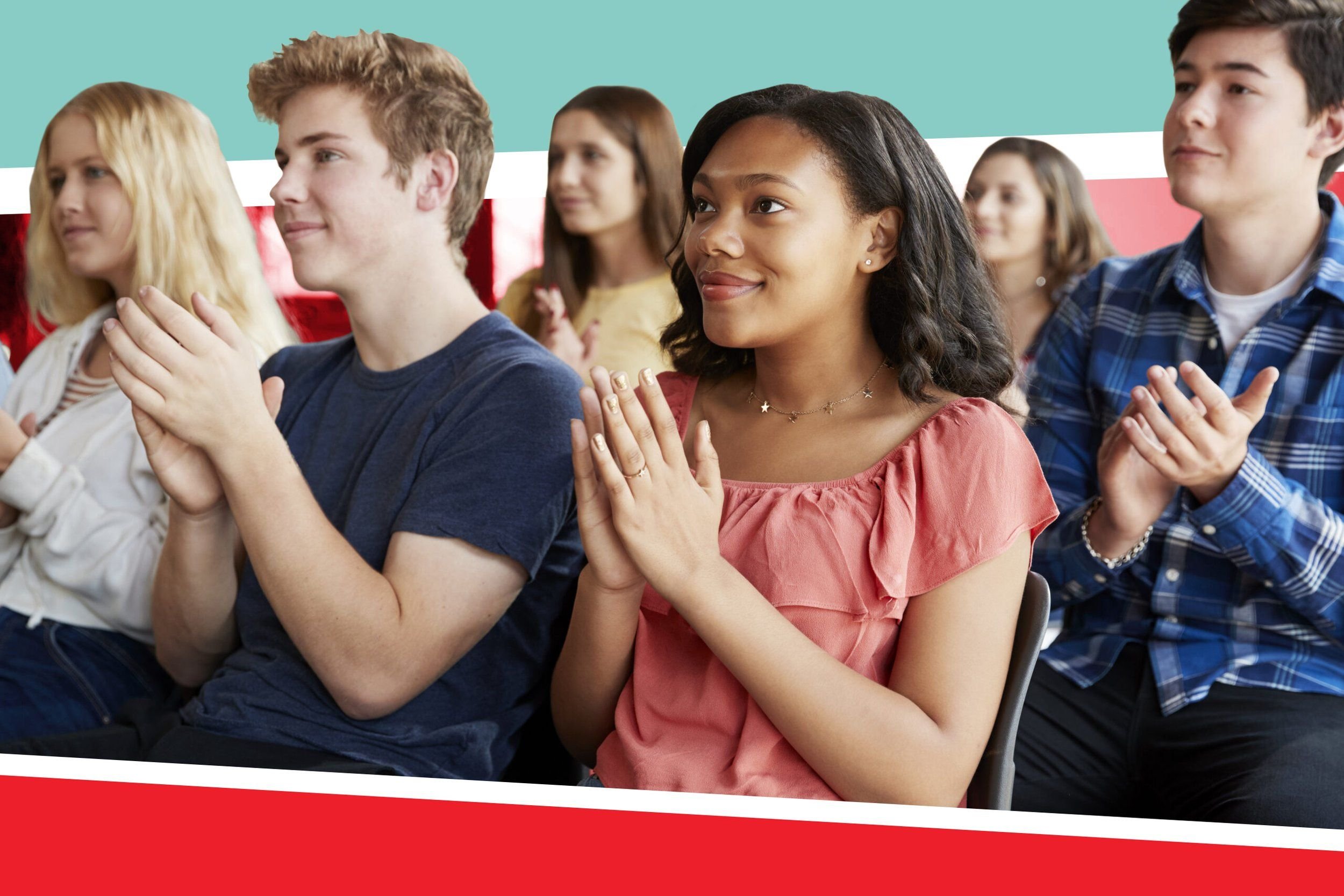 A group of students applauding a persuasive speech