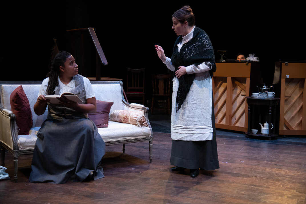  Khadija Bangoura as Eliza Doolittle and Taylor Brahms as Mrs. Pearce in MY FAIR LADY, directed by Avital Shira. Photo by Andrew Brilliant. 
