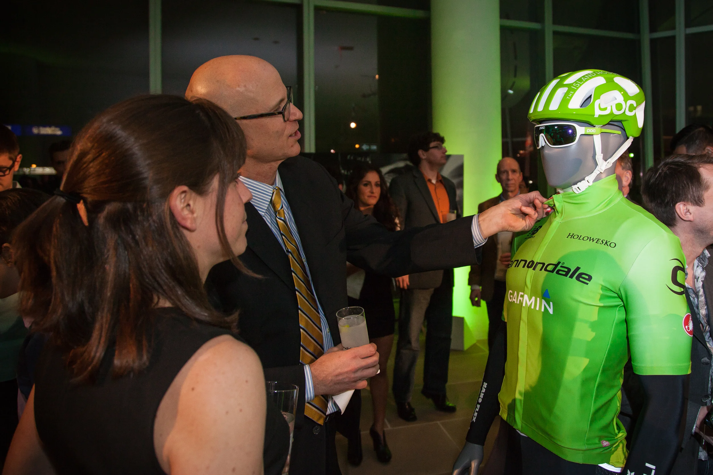 A guest inspects the new green kit for the Cannondale-Garmin Pro Cylcing team at the NYC launch event.