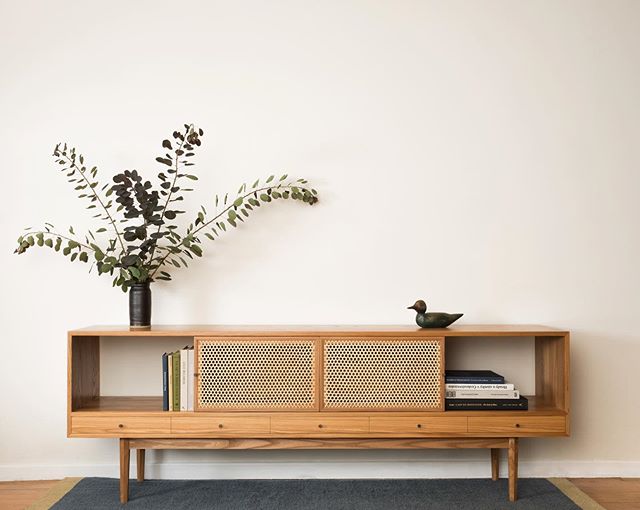 Tinselor Credenza before its journey to California. &bull;
Elm, caned sliding doors, some tiny drawers, topped off with house made brass knobs.