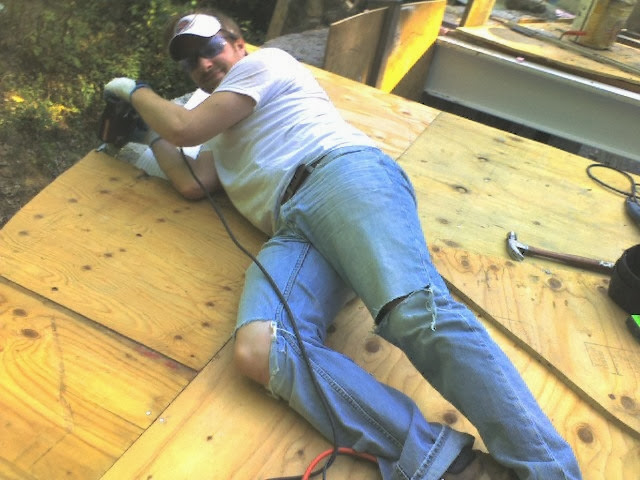 Jon Barker trims the living room roof deck.