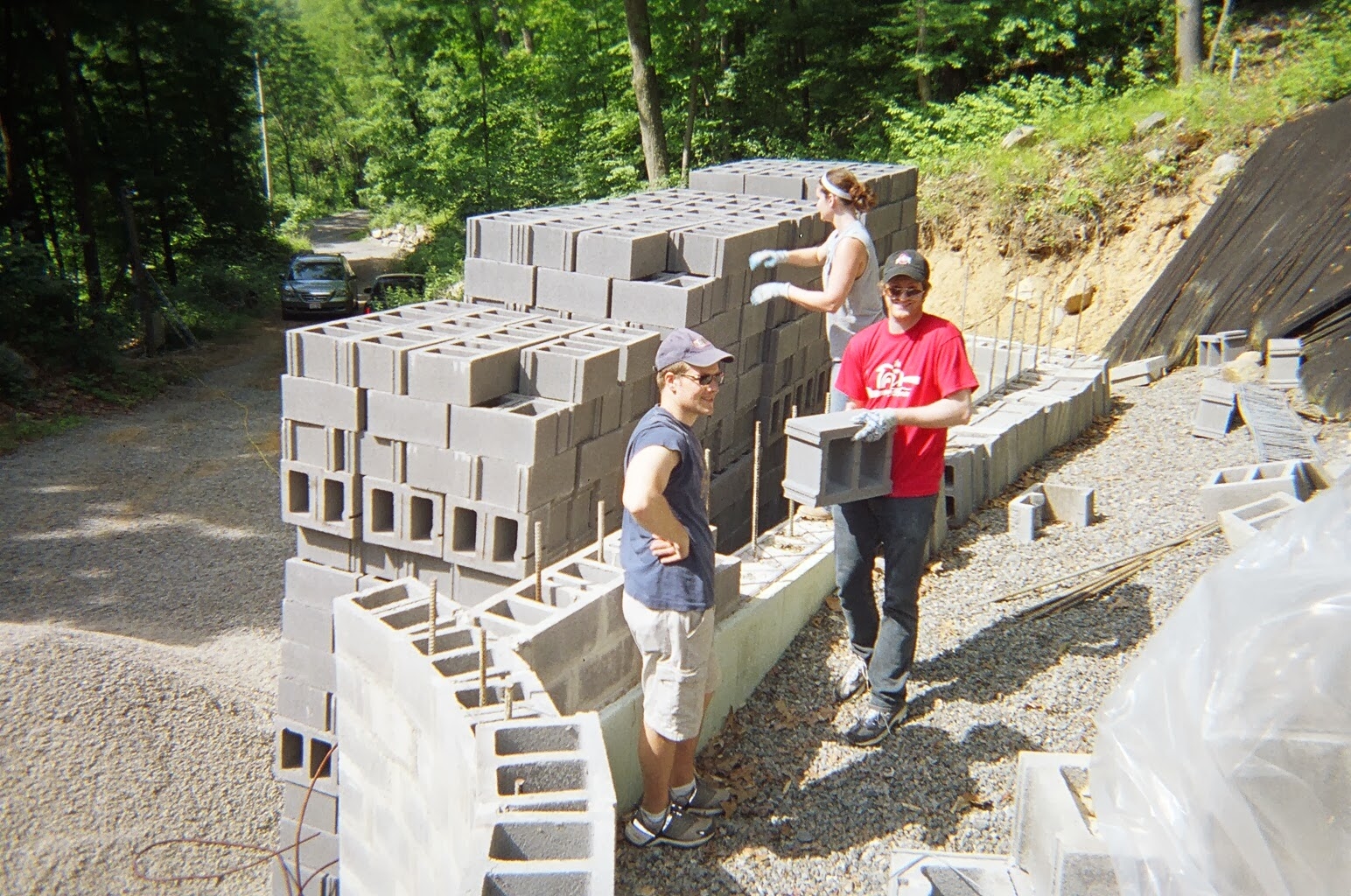 Ben Bucher, Carey Van Driest, and Andy Jobe haul block for the center wall.