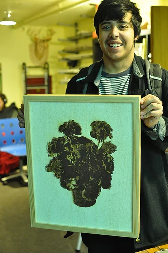 Fritz Rodriguez opted to swear at the file himself. For him, the lasercut was just the first step. He then photographed and printed the burned, woodsy version of this image of flowers, which is a royalty-free patent illustration.