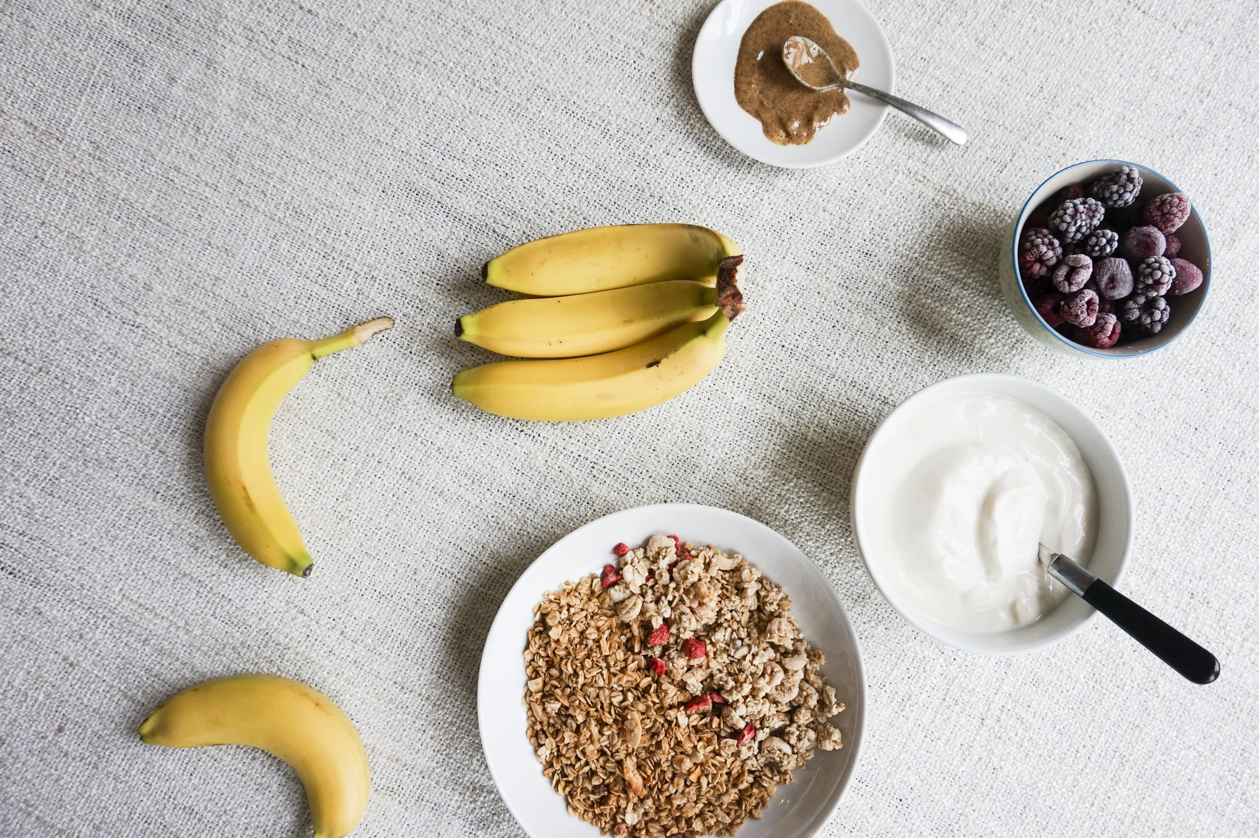 The ingredient list is simple: 1. Fresh Bananas 2. Vegan yogurt or yogurt of your choice (if you want to eat this as a dessert, ice cream will do!) 3. Granola of your choice! (we used Spoon Cereal & Jordans Cereals ) 4. Fresh berries or frozen berries 5. Almond butter