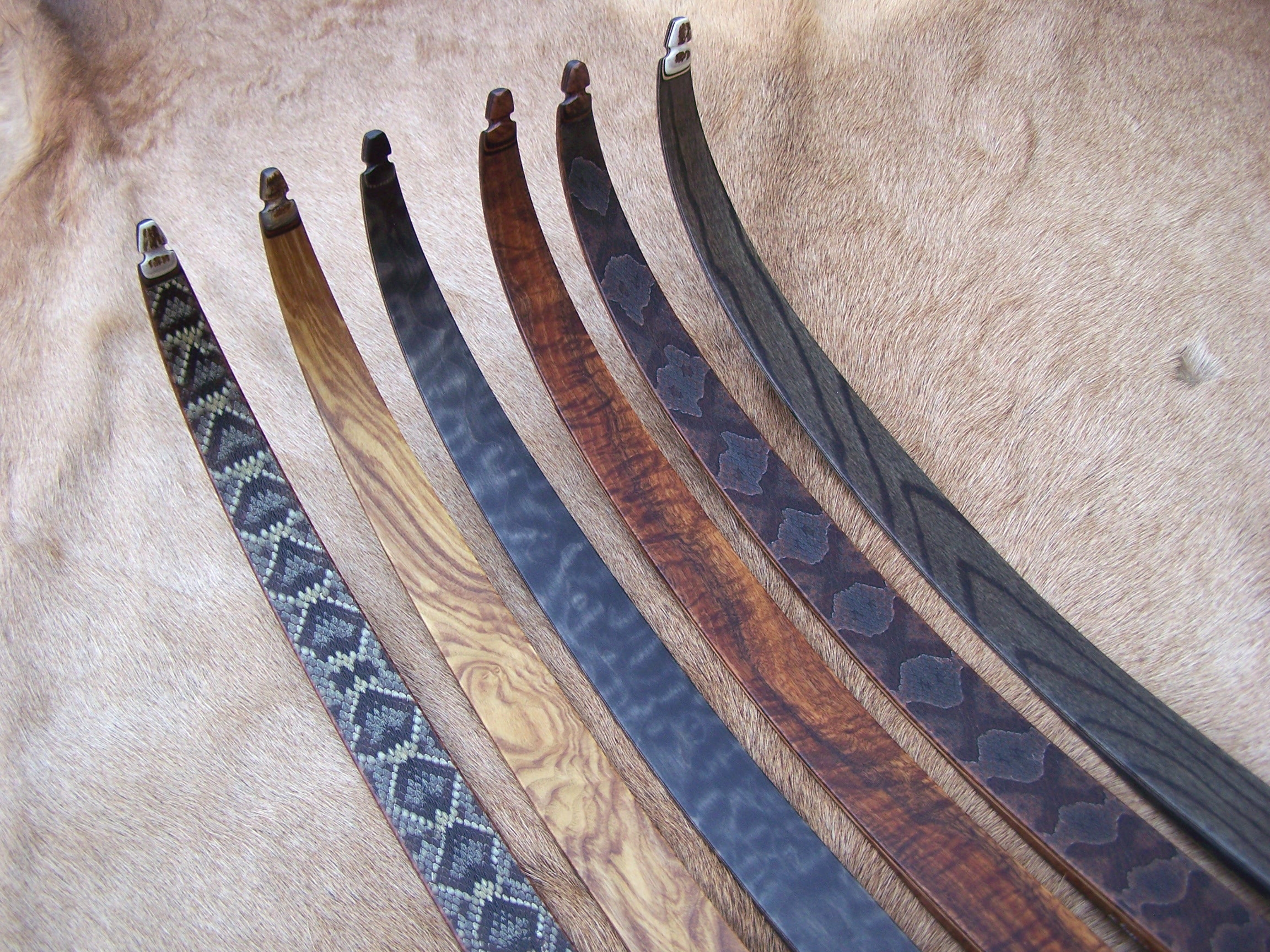 Left to Right- Diamondback skins, Olive Ash, Quilted Maple stained charcoal, Koa, Copperhead skins, Red Elm stained charcoal