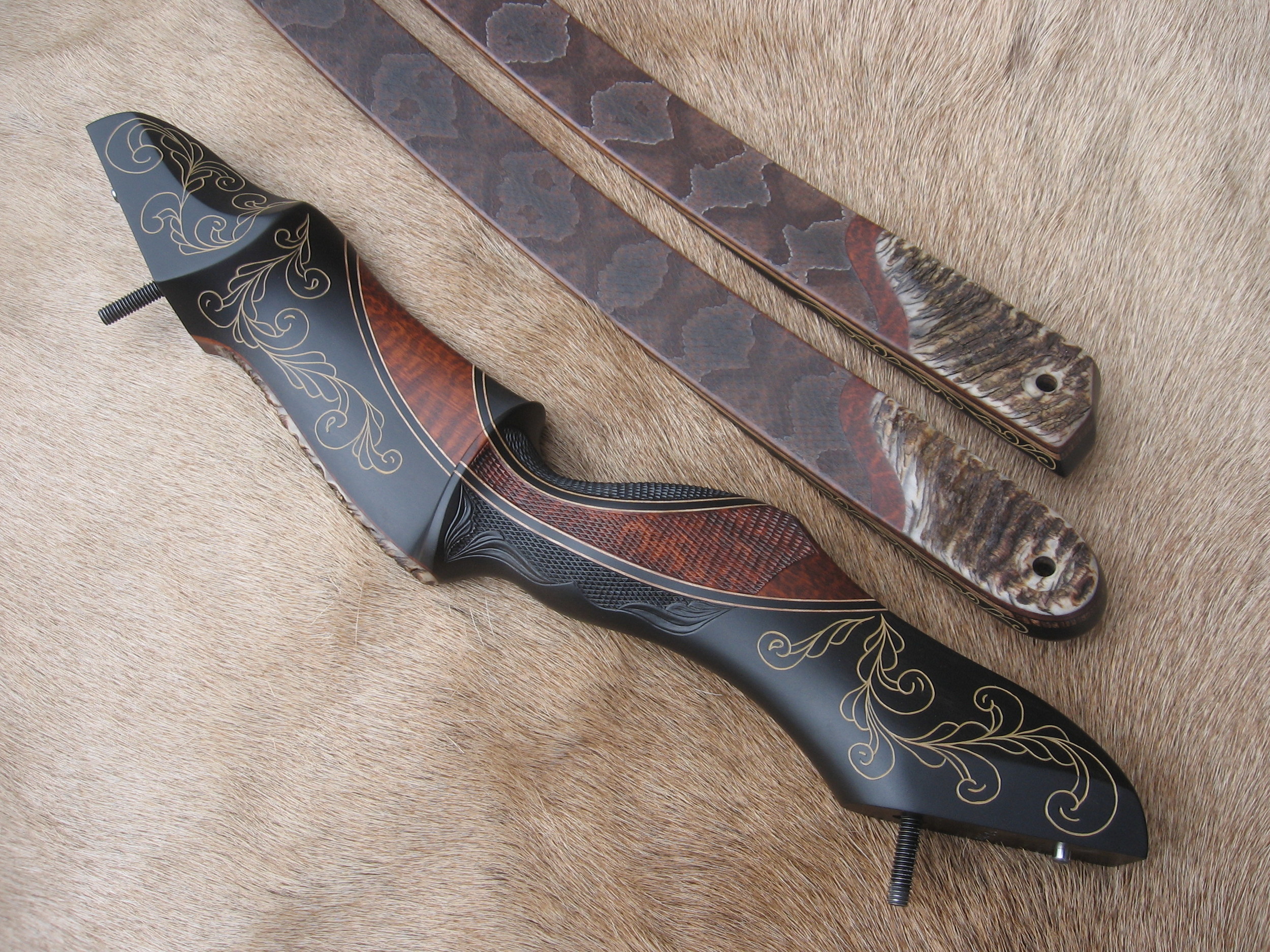  Gaboon Riser, snakewood crescent, hand carved scrolling. Call or e-mail for quote. 