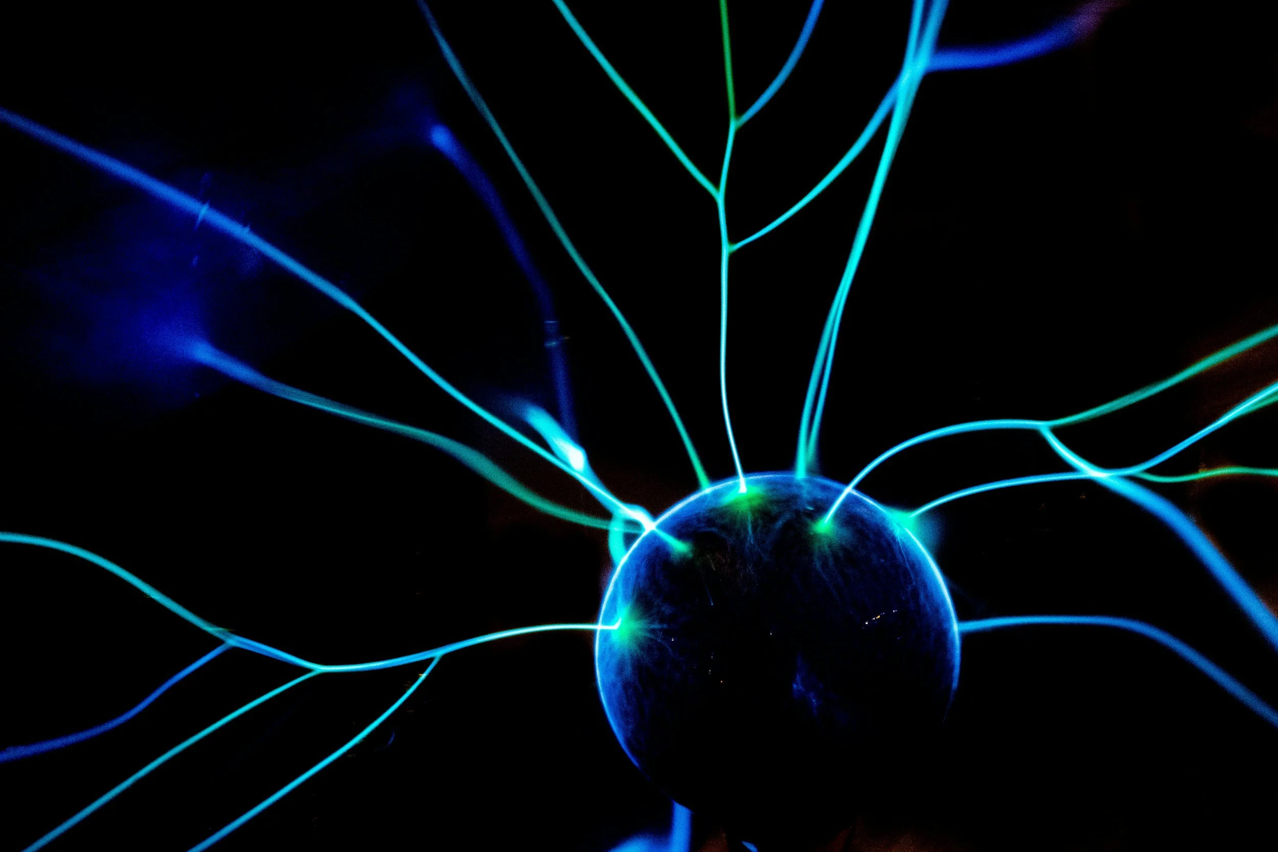 nucleus in bright blue in green with black background