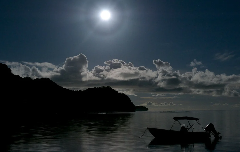A 22° halo is an optical phenomenon forming a circle with a radius of 22° around the Sun or the Moon as seen here around a full moon in Palau.