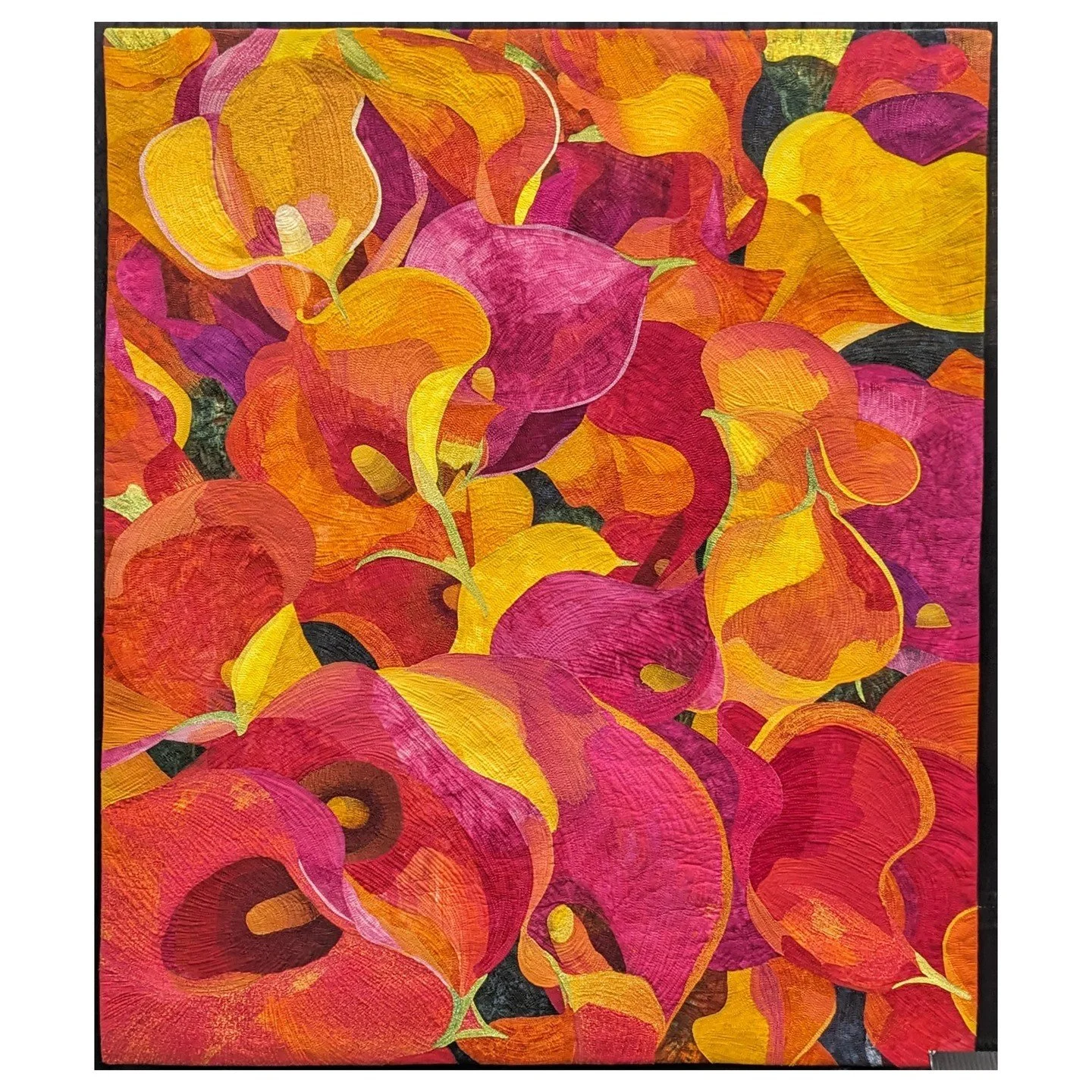 NOT MY WORK. This is Las Calas de Valdivia by Pilar Donoso. Seeing these bright cheery colors on a bleak January day give me hope that spring will eventually come. The sense of dimension that she captured is amazing as is all of the detailed quilting