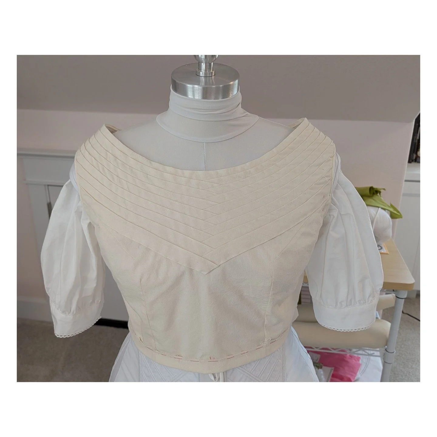 Bodice mock-up #2. I got a much better fit on the bodice and changed the Bertha strips from round, which looked Egyptian to me, to pointy, which I like better. Sewing all the strips on shrank the bodice, though, so it doesn't close in the back. I thi