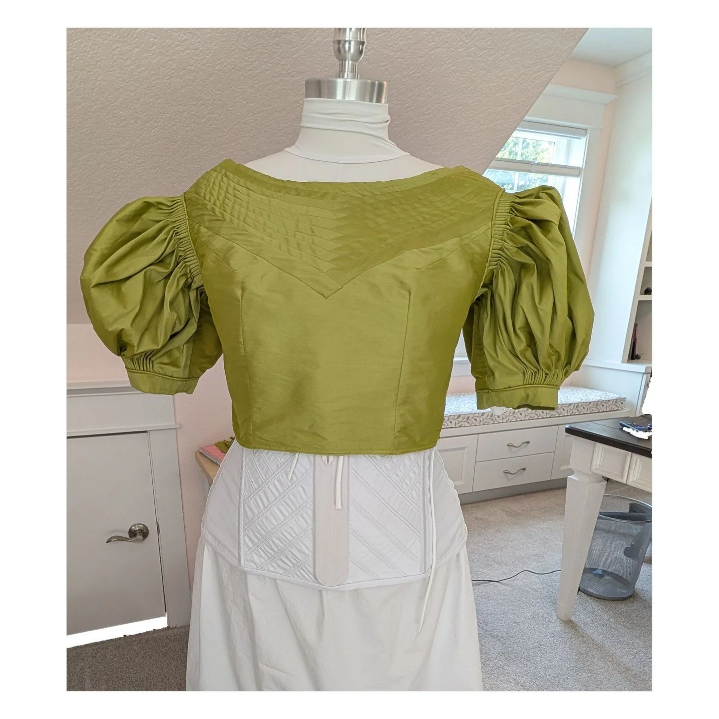 Progress continues on my Biedermeier dress! I have the bodice done with the Bertha strips coming to a point in the front and rounded in the back. I added ties to the inside of the sleeve so I can tie the sleeve fluffer to the bodice and not to the co