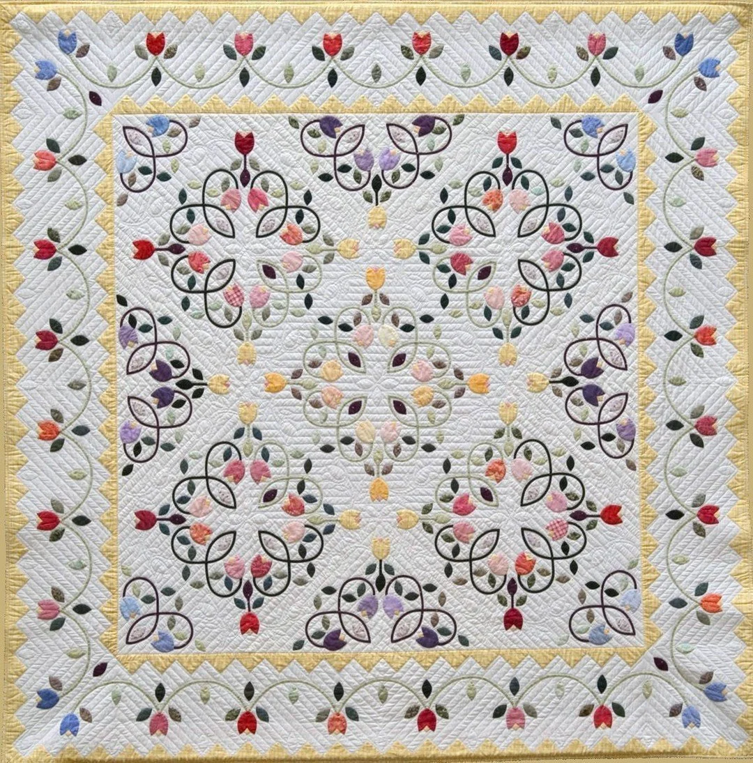 One of my earliest quilts, and still one of my favorites! I've taught so many people how to appliqu&eacute; using this pattern, which was my first. If I could go back in time and buy more of the yellow fabric, I would! I've never been able to find an