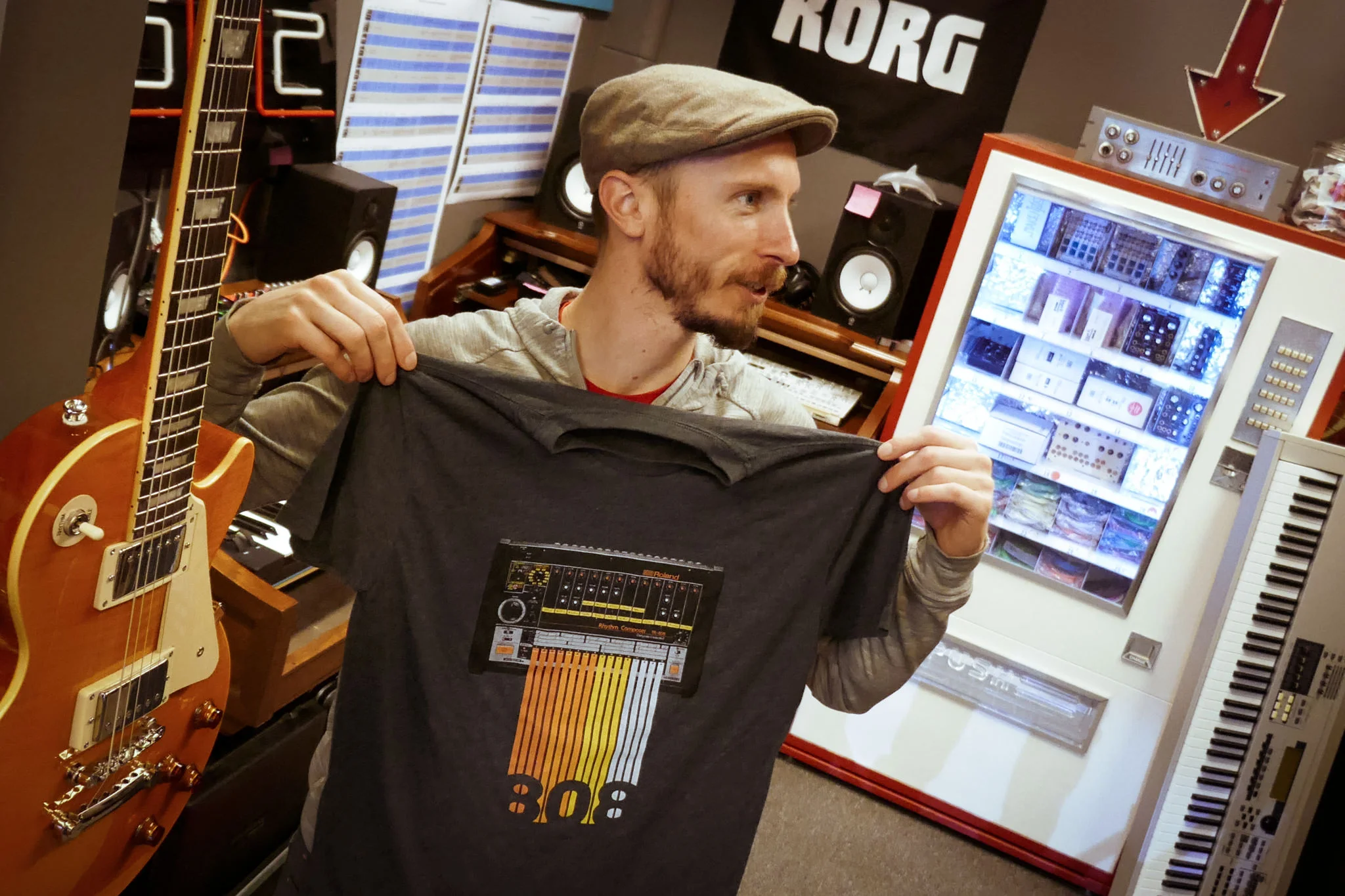 Matthew Fit examines a Roland 808 T-Shirt.
