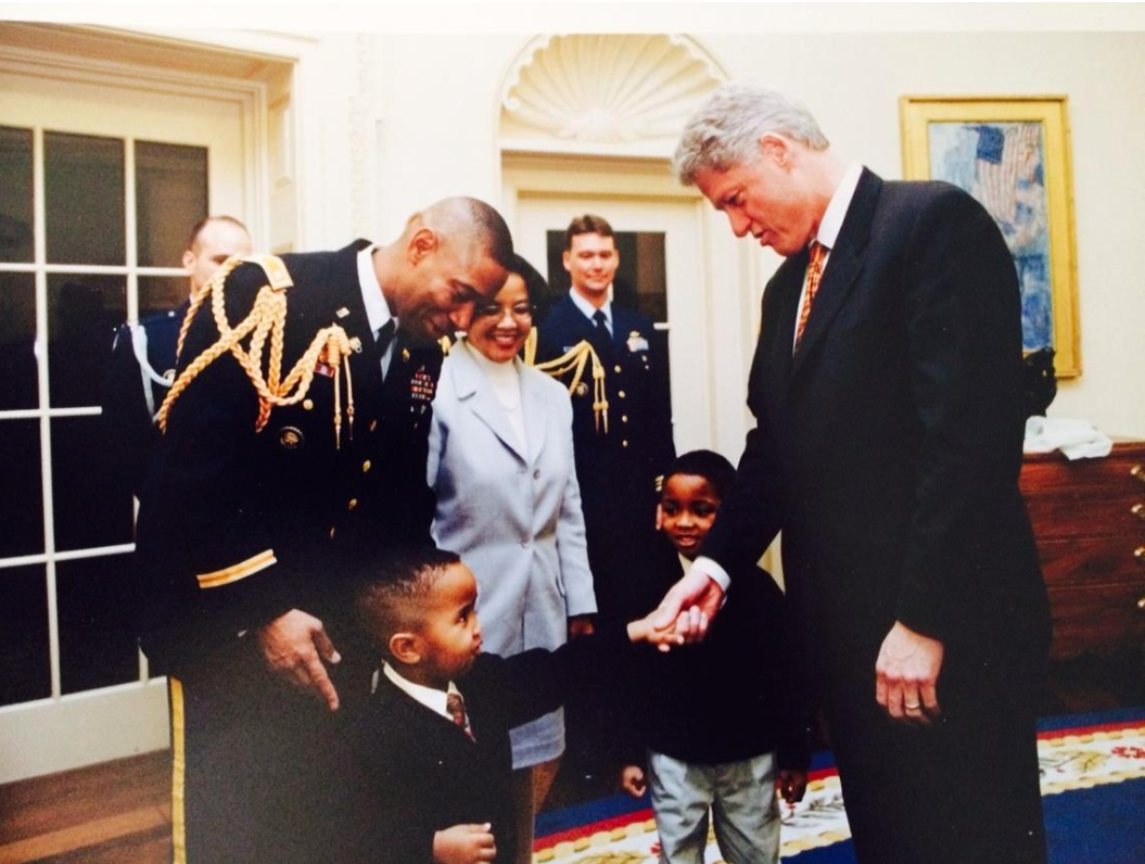 Dana Pittard and Lucille Pittard with their sons in the White House, meeting President Bill Clinton.