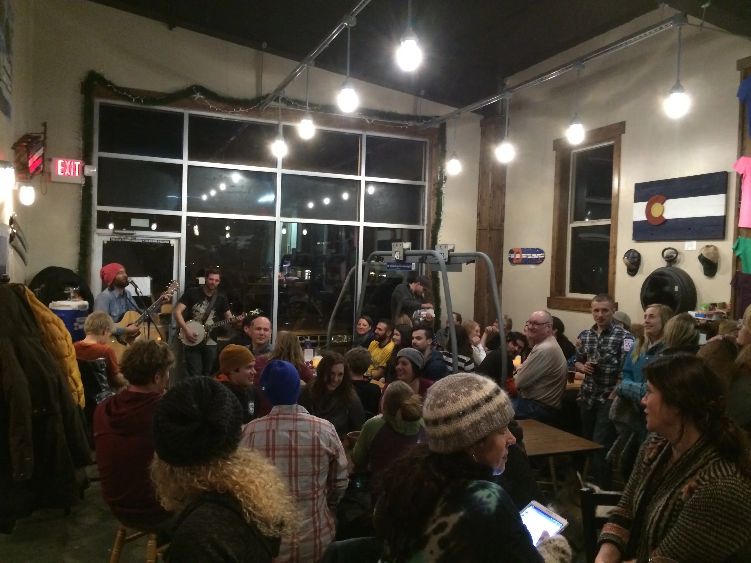 Cody and JJ perform to a packed potluck