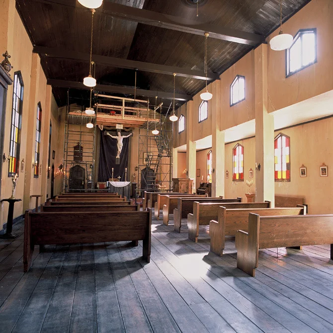 An interior view of the San Ramos church build. The scaffolding around the crucifix was a story point, allowing an immigrant boy to hide in the ceiling of this crumbling old building.