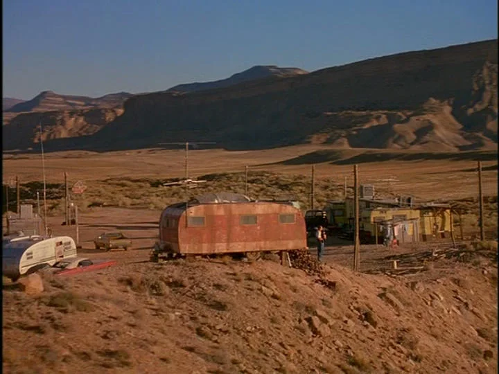 In Nobody's Baby, two hapless cons (Skeet Ulrich & Gary Oldman) escape from jail and end up rescuing a baby from a car accident, resulting in a desperate journey across a bleak and empty American southwest. Here Billy (Skeet Ulrich) confronts his new reality in this harsh and broken down trailer park we build on a remote desert plateau.