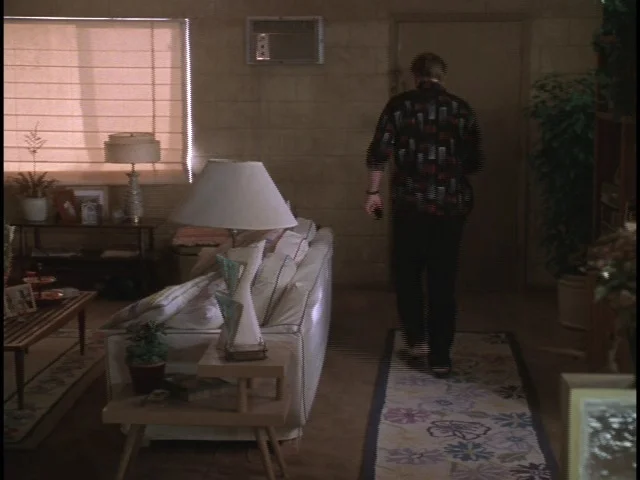 Edward's (Ron Eldard) crummy gambler's Vegas apartment stage set.