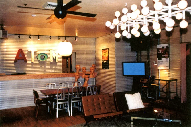 The short film distribution company Atom Films hired me to create a walk-in lounge for Sundance 1999 in a horrid mess of a Chinese Restaurant on Main Street in Park City, Utah. The request was a cool Soho loft feel on a limited budget and two days for the transformation.
