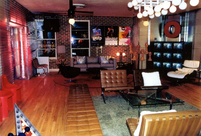 We broomed out the restaurant stuff, tore up the jade carpet, buried most of the walls behind semi-visible steel studs and white or translucent corrugated fiberglass and vacu-form brick walls, and brought in all the mid-century Scandinavian and 60's mod we could find at short notice.