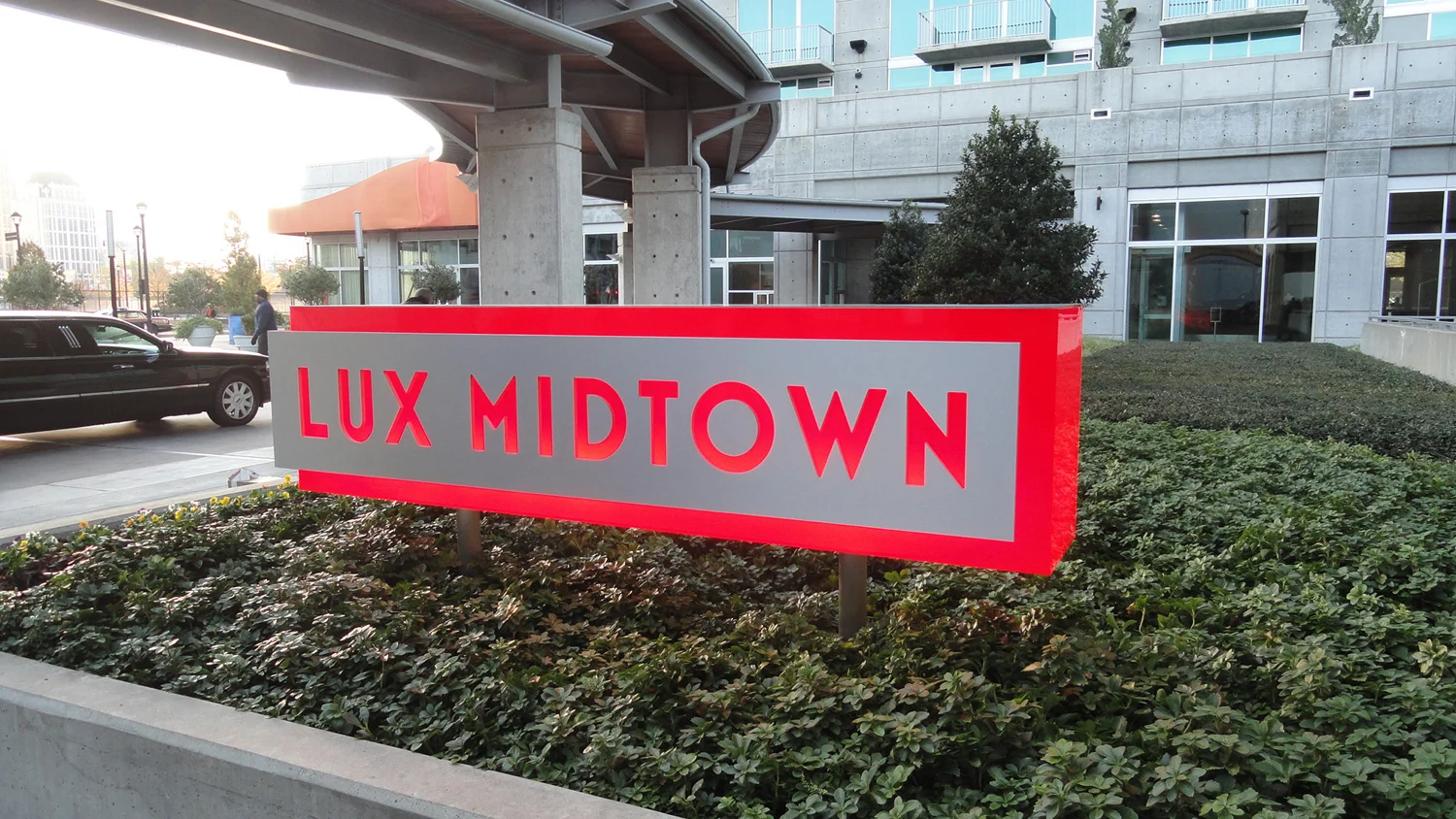 A lovely, glowing red sign we made for our fictional luxury hotel.