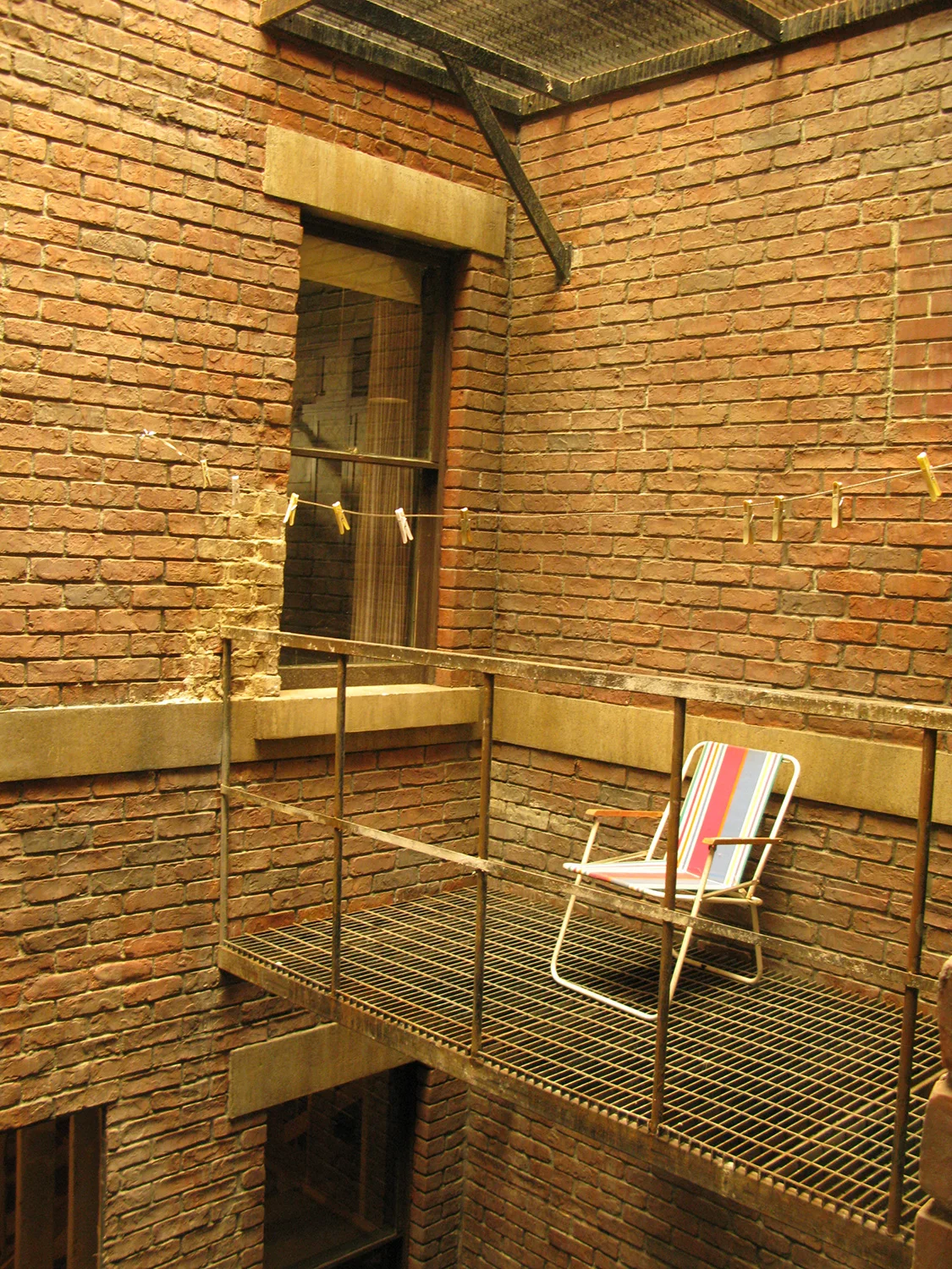 The script required a moment where Peyton (Austin Butler) calls to Sharpay(Ashley Tisdale) from his neighboring apartment window. I designed a "Lightwell", an architectural detail typical of 19th century multi-story New York apartment buildings that allowed air and sunlight to service inner rooms, and thus allowed our hero's windows to be straight across from each other. This also required the entire floor of the apartment building to be on a 6 foot riser. Here is a detail of the lightwell.