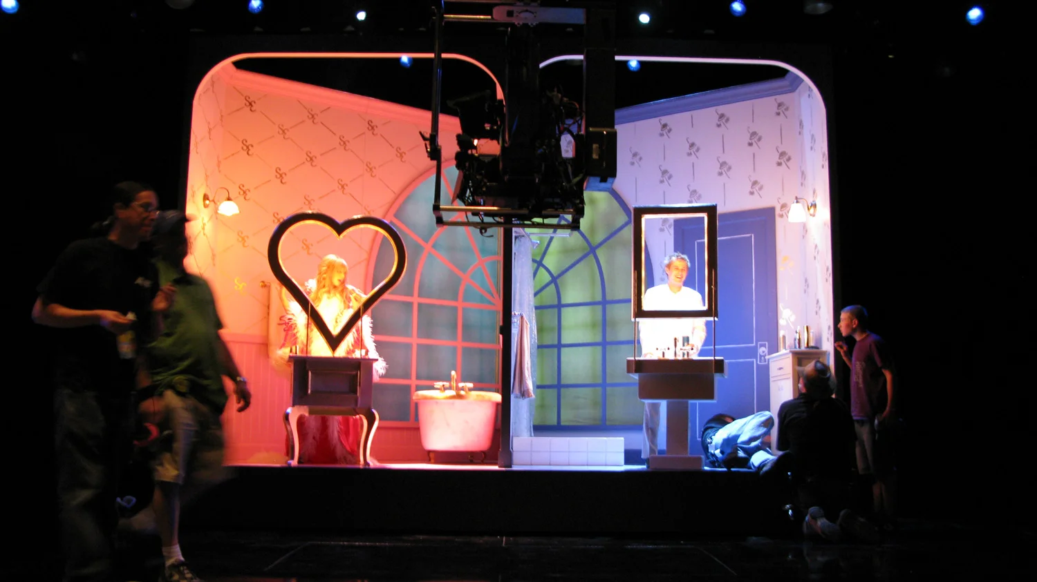 Sharpay (Ashley Tisdale) and Ryan (Lucas Grabeel) prepare for their big prom night in their split bathroom wagon set. The bathroom rolls away, and a curtain raises revealing a neighborhood.