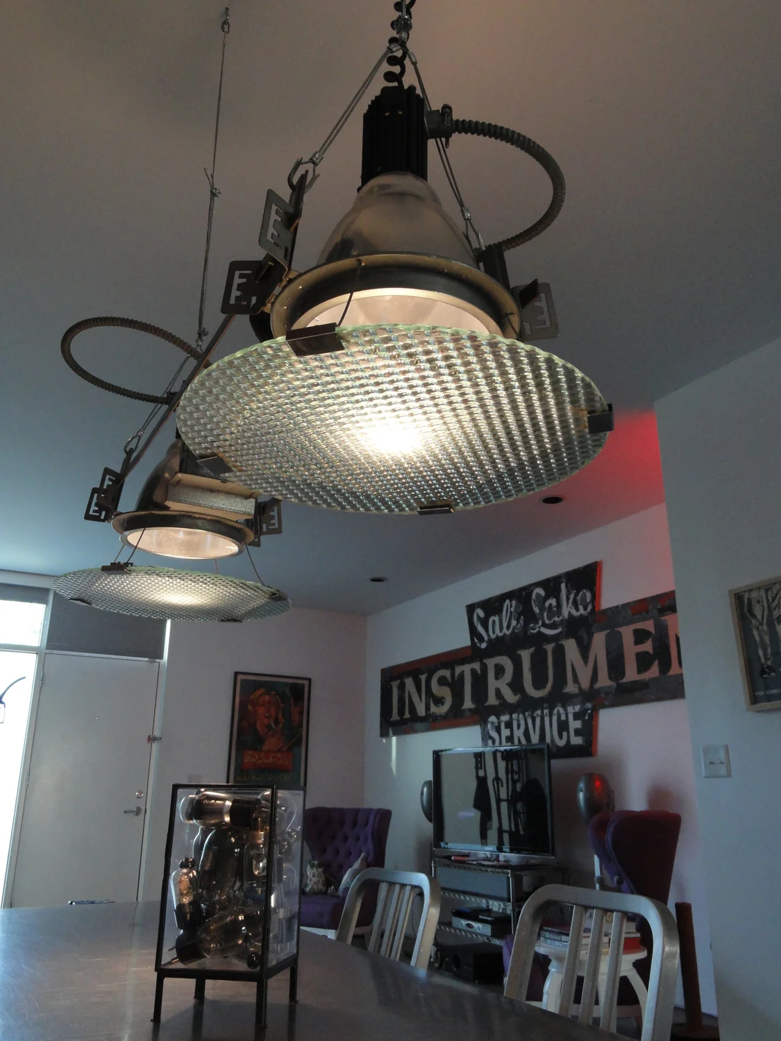 Underside of the dining table lamp, showing the suspended glass lenses.