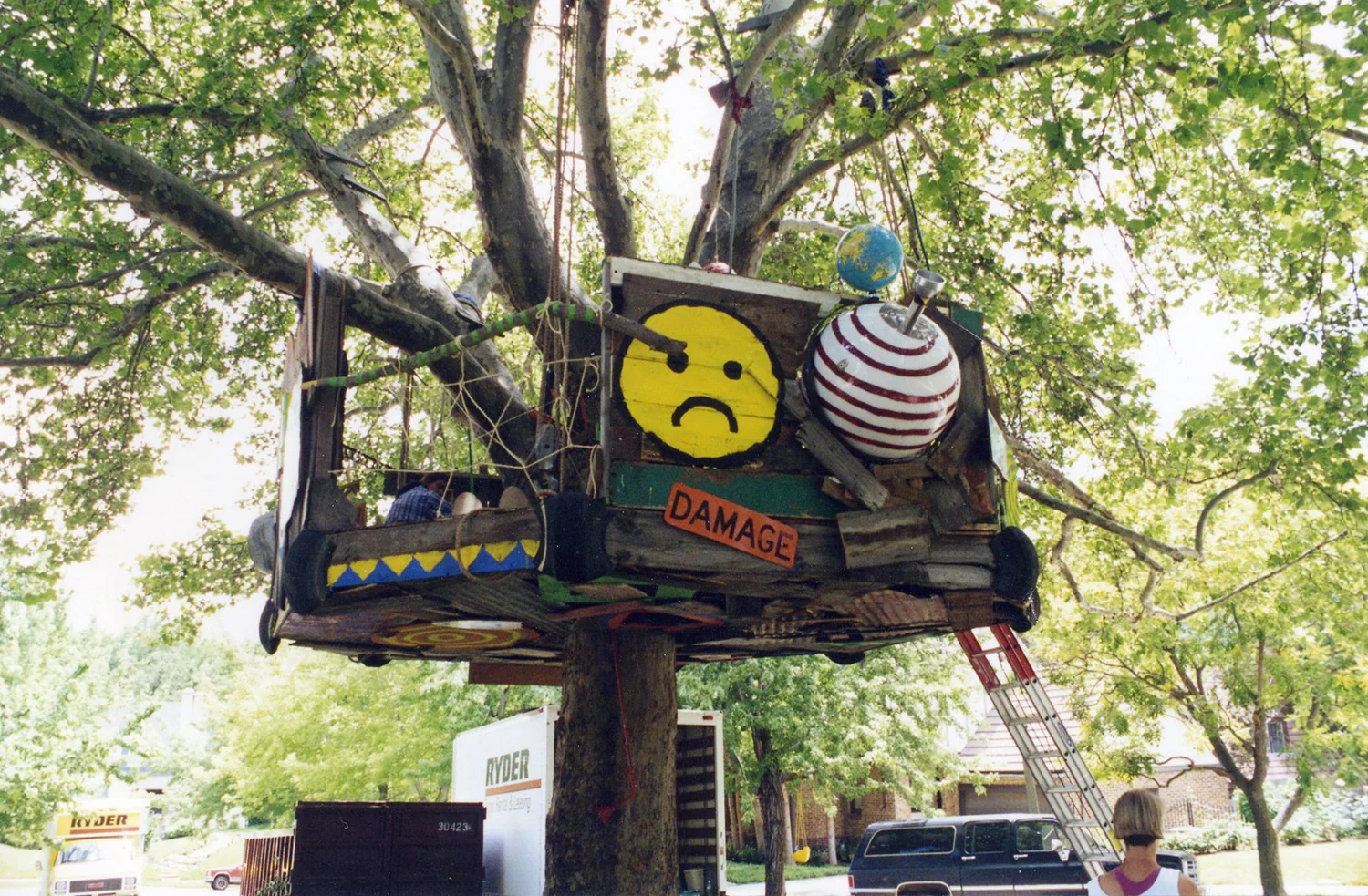 Another aspect of the treehouse, showing the working "ball-tourit" complete with double fire extinguisher water tanks that the mischievous boys who built the treehouse use to attack passers-by.