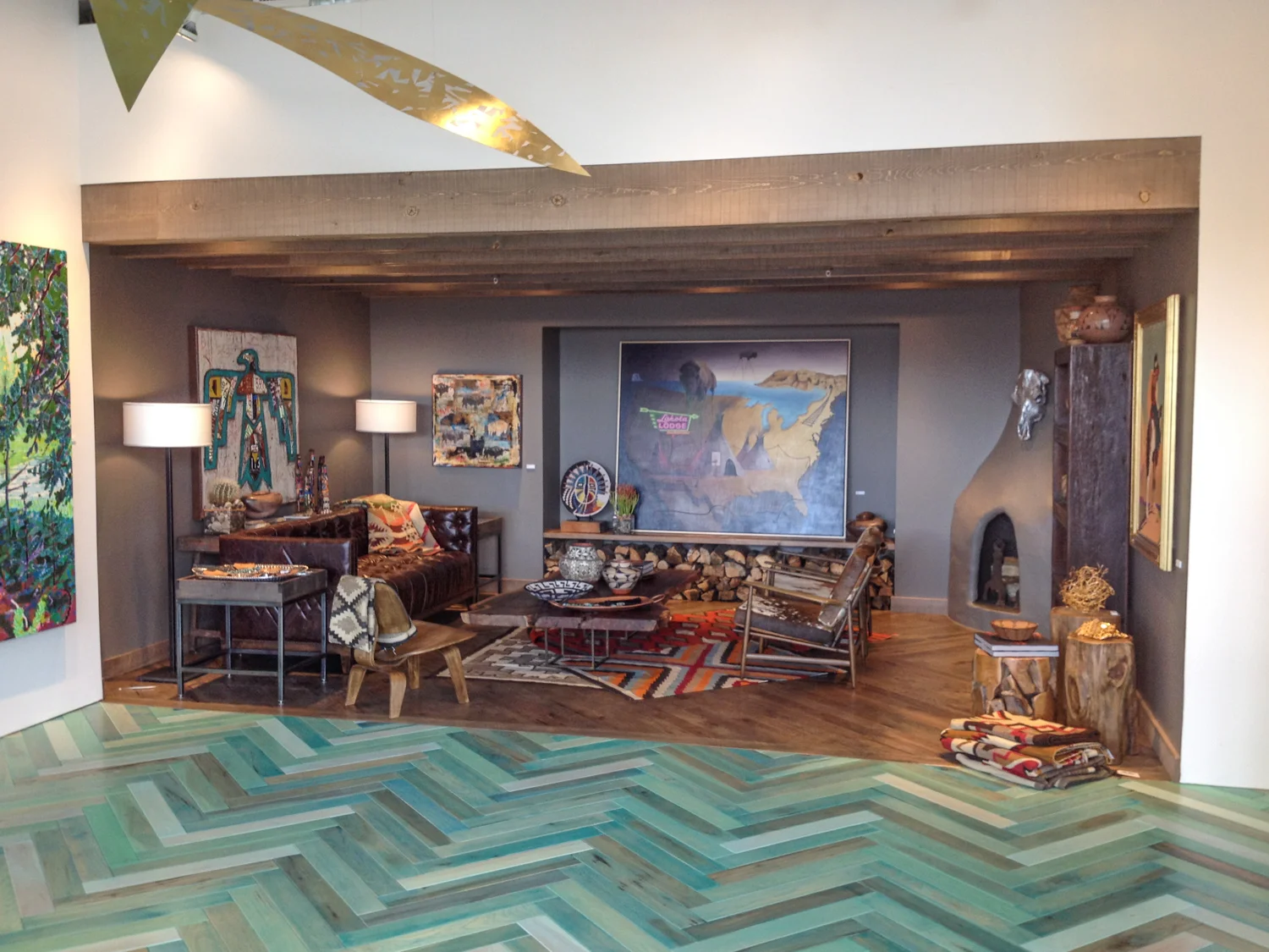 The Den or Closing Room. This vignette of a comfortable, southwestern style living room allows a customer to relax while viewing selected pieces of art outside the common, white gallery setting.