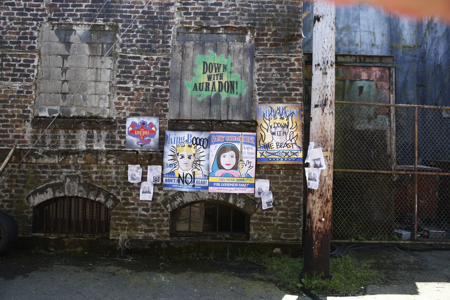 This is a detail of the cheerful and largely hopeless propaganda campaign the good people of Auradon paste up on the streets of the Isle in hopes of rehabilitating the fallen villains. In no time at all the people of the Isle make their feelings known. © (DISNEY CHANNEL / Jeff Weddell)