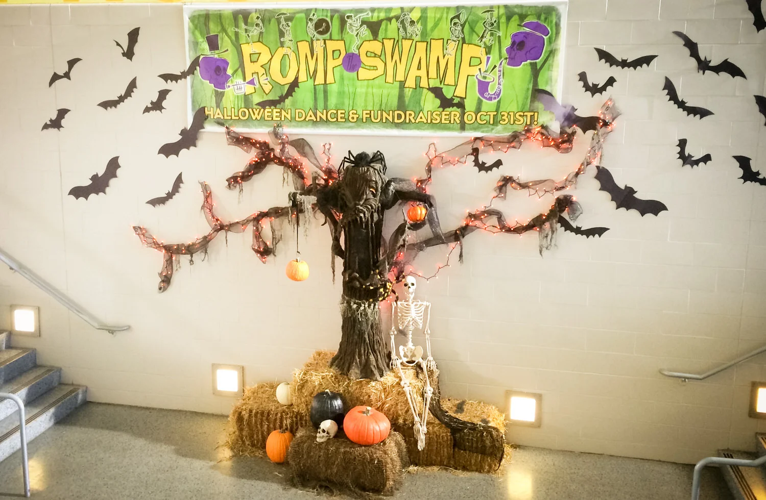 A display in the high school lobby for the social event of the year, the annual Romp the Swamp Halloween dance and fundraiser.