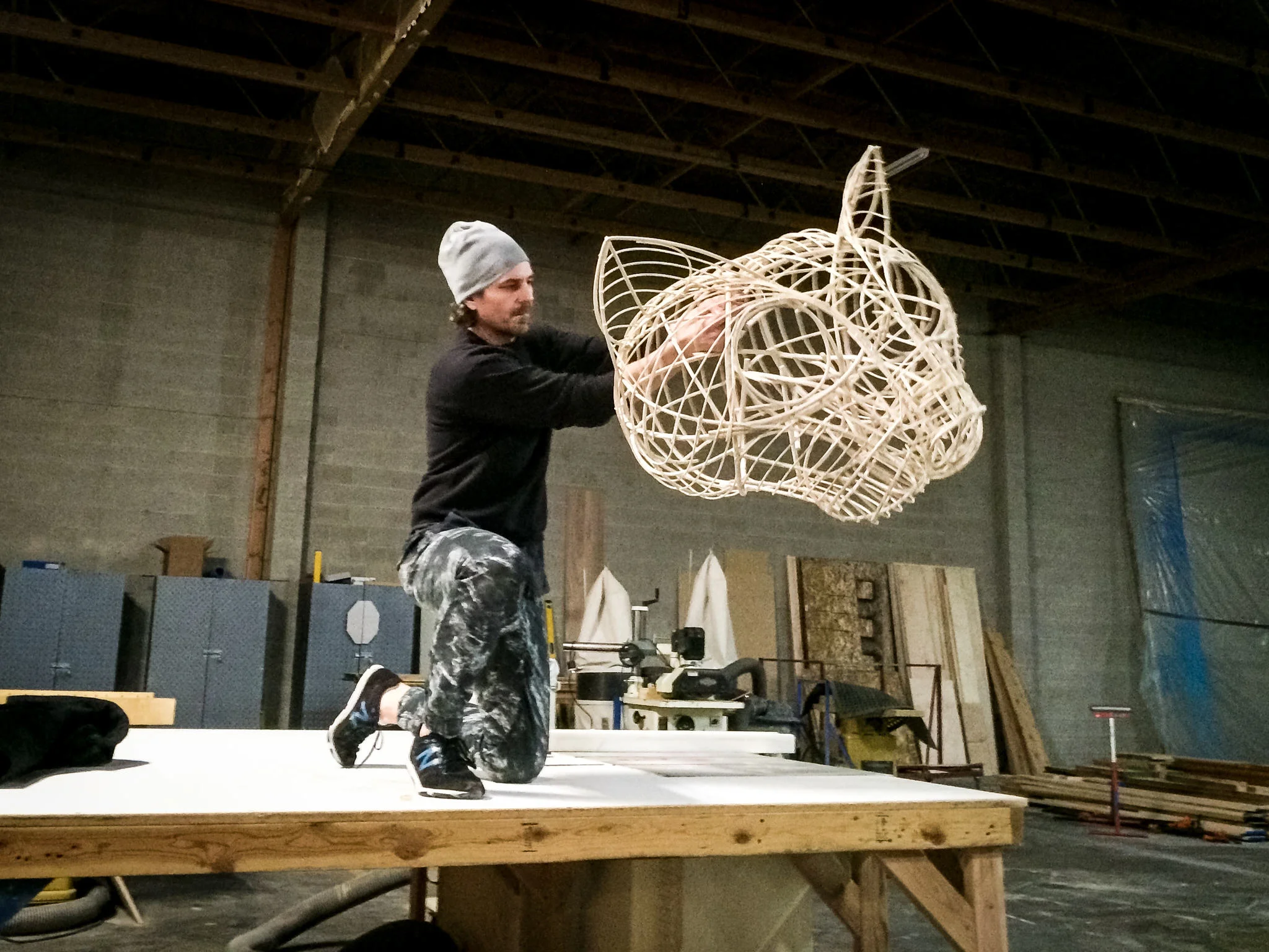 Since the actor would often be operating the head one-handed, it had to be light. I hadn't built a wicker piece since college, but it was obviously the right approach. Here Robert Scott Smith tries it out for the first time.