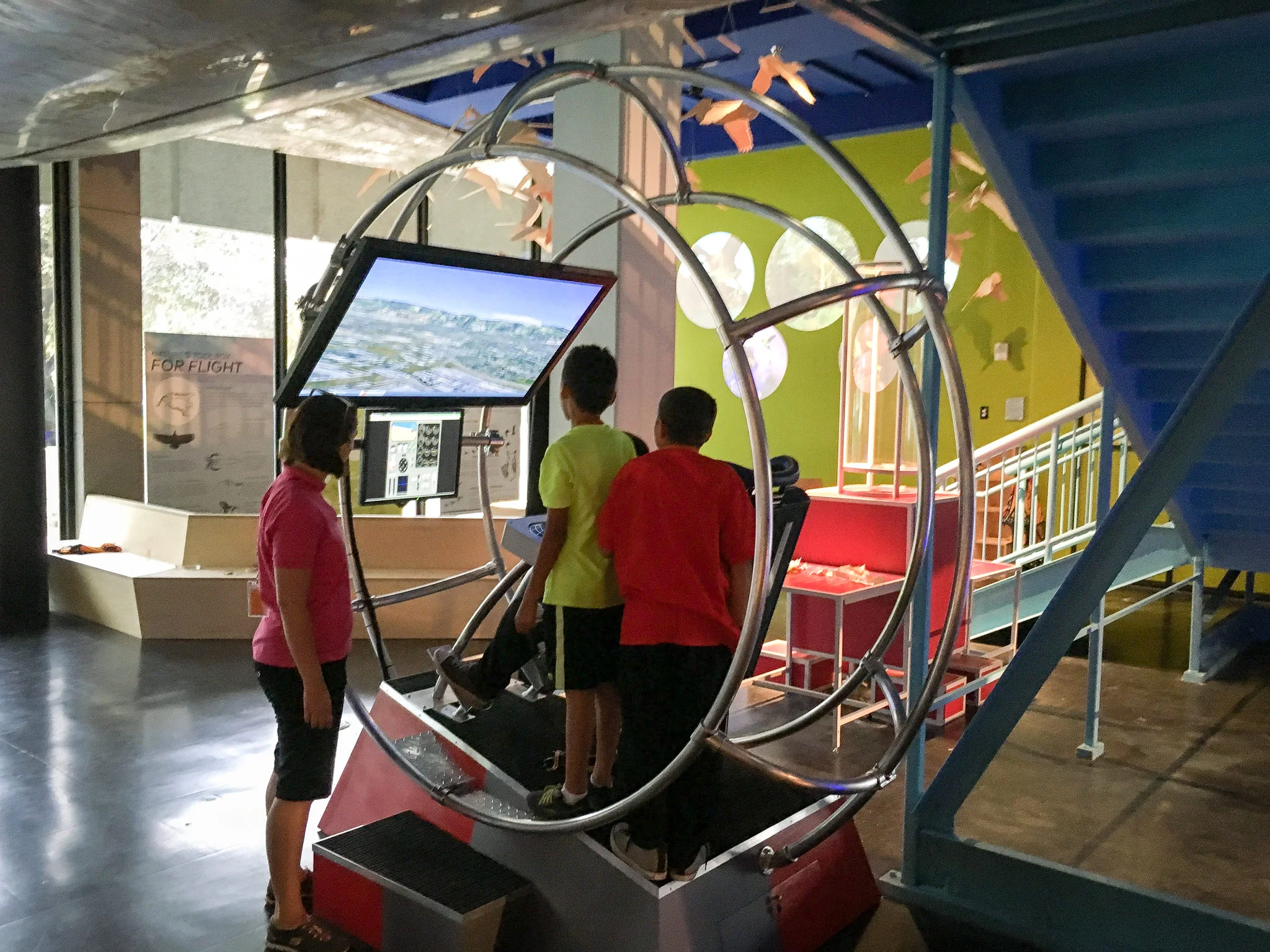 We felt that rather than trying to reproduce a traditional cockpit for the simulators, a more open design would make it a communal rather than an individual experience. Our triple ring housing with fighter-pilots seats kept the cool factor while being open and letting groups of friends enjoy the installation together. 