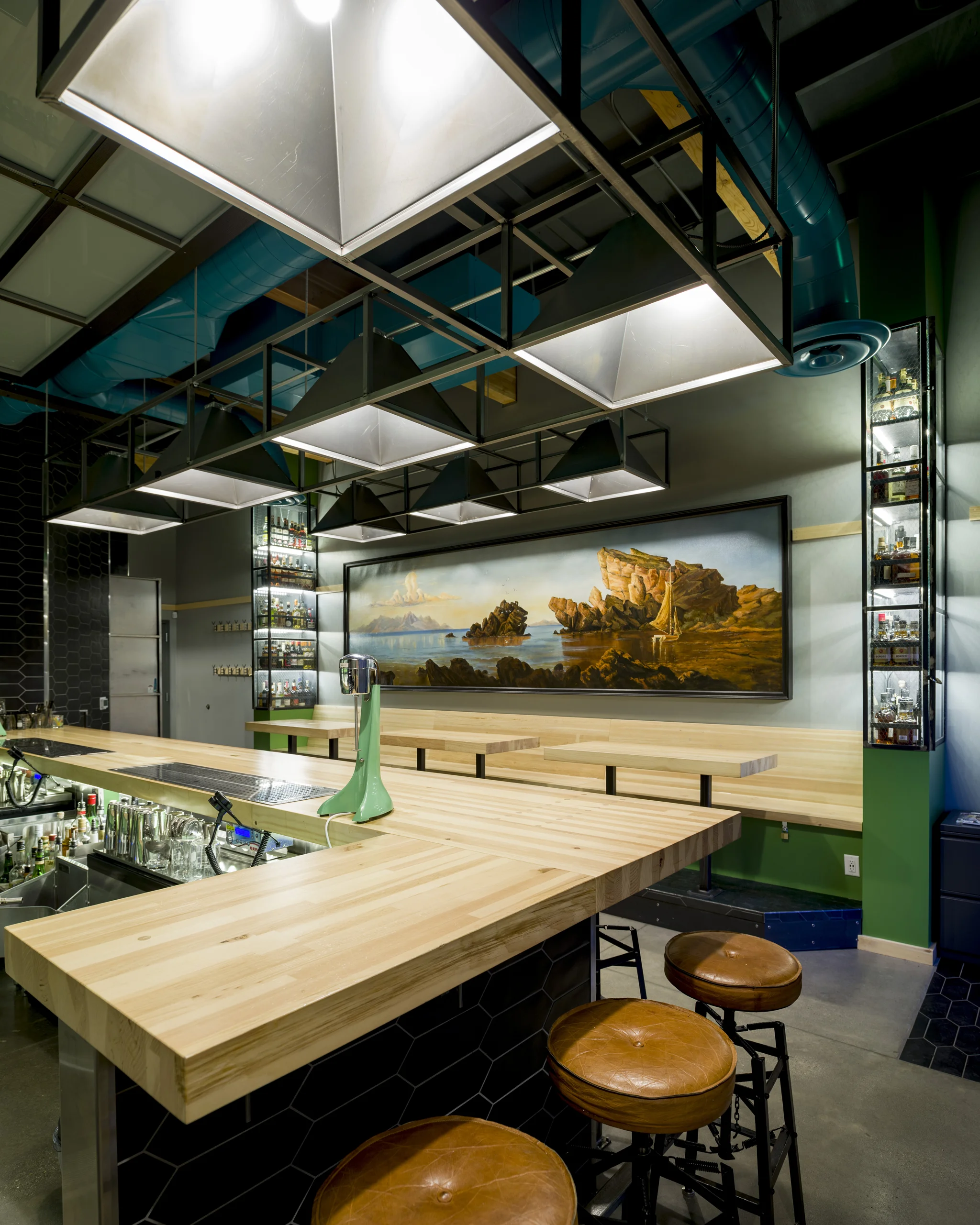 Upon our first meeting with the guys I gleaned from them that this was to be their workspace, not precious, not pretentious but a workshop as well as a neighborhood bar where they would almost never have to turn their backs on their valued customers.