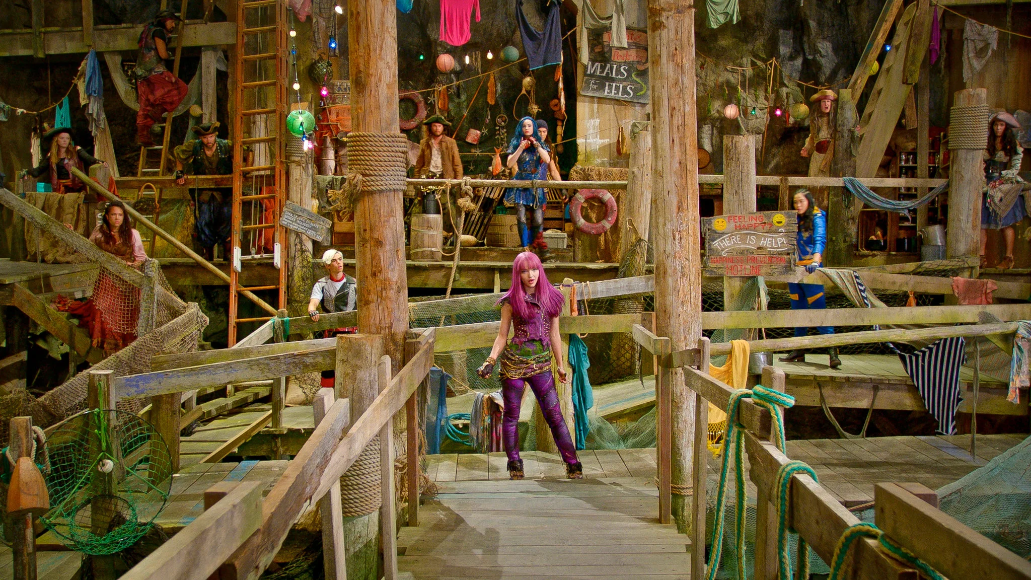 Mal (Dove Cameron) faces off across the gang plank from Uma's pirate gang.