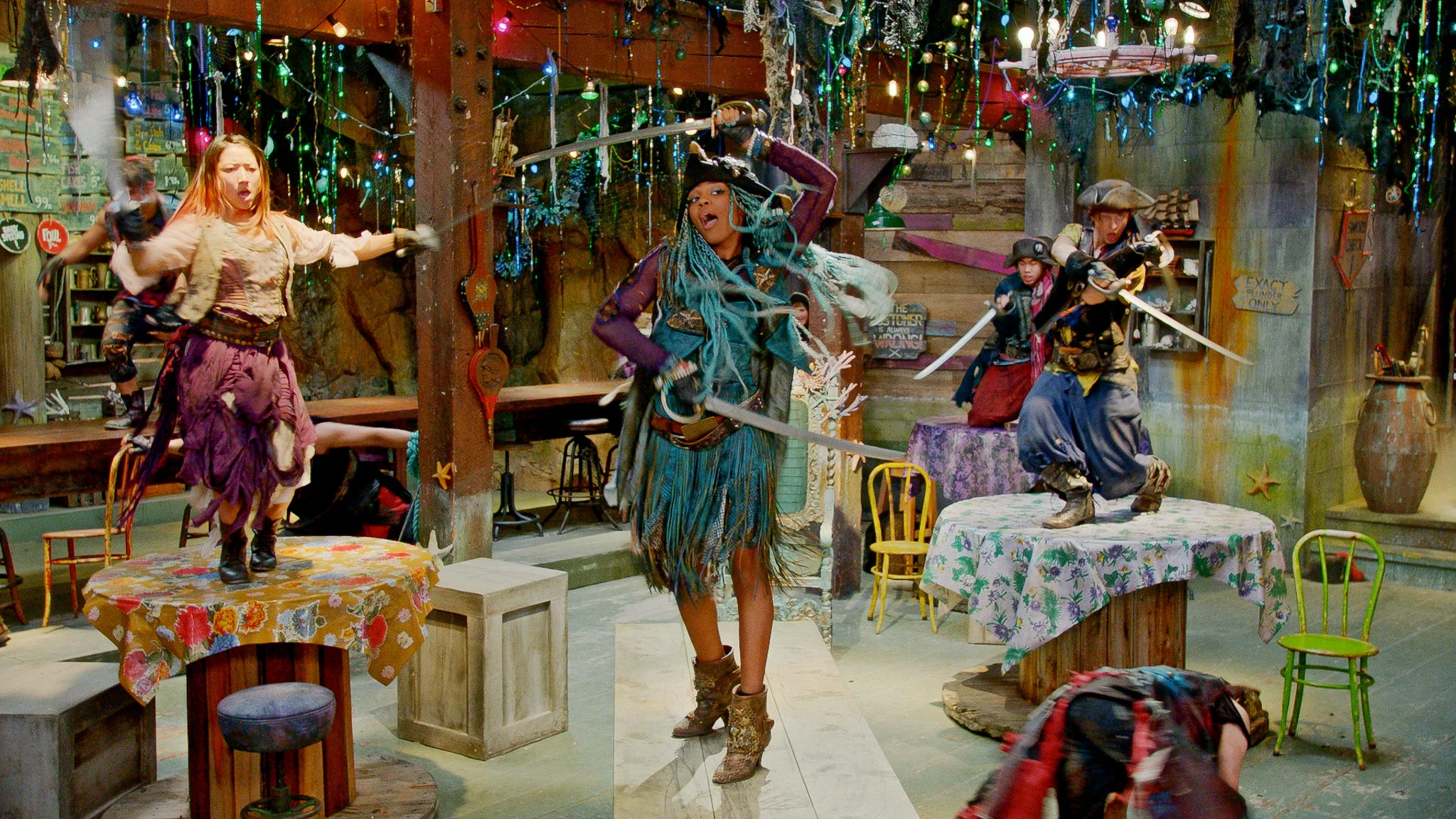 Here the ambitious and embittered Uma (China Anne McClain) rallies her pirate gang inside the Fish and Chips Shoppe, where her Sea Witch mother Ursula has pressed her into dreary service.
