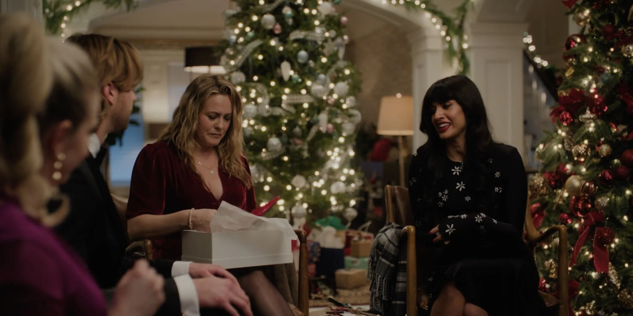  The reverse of Everett’s house with Kate (Alicia Silverstone) receiving an expensive gift from Tess (Jamila Jamil), Everett’s flashy, big-city girlfriend.  