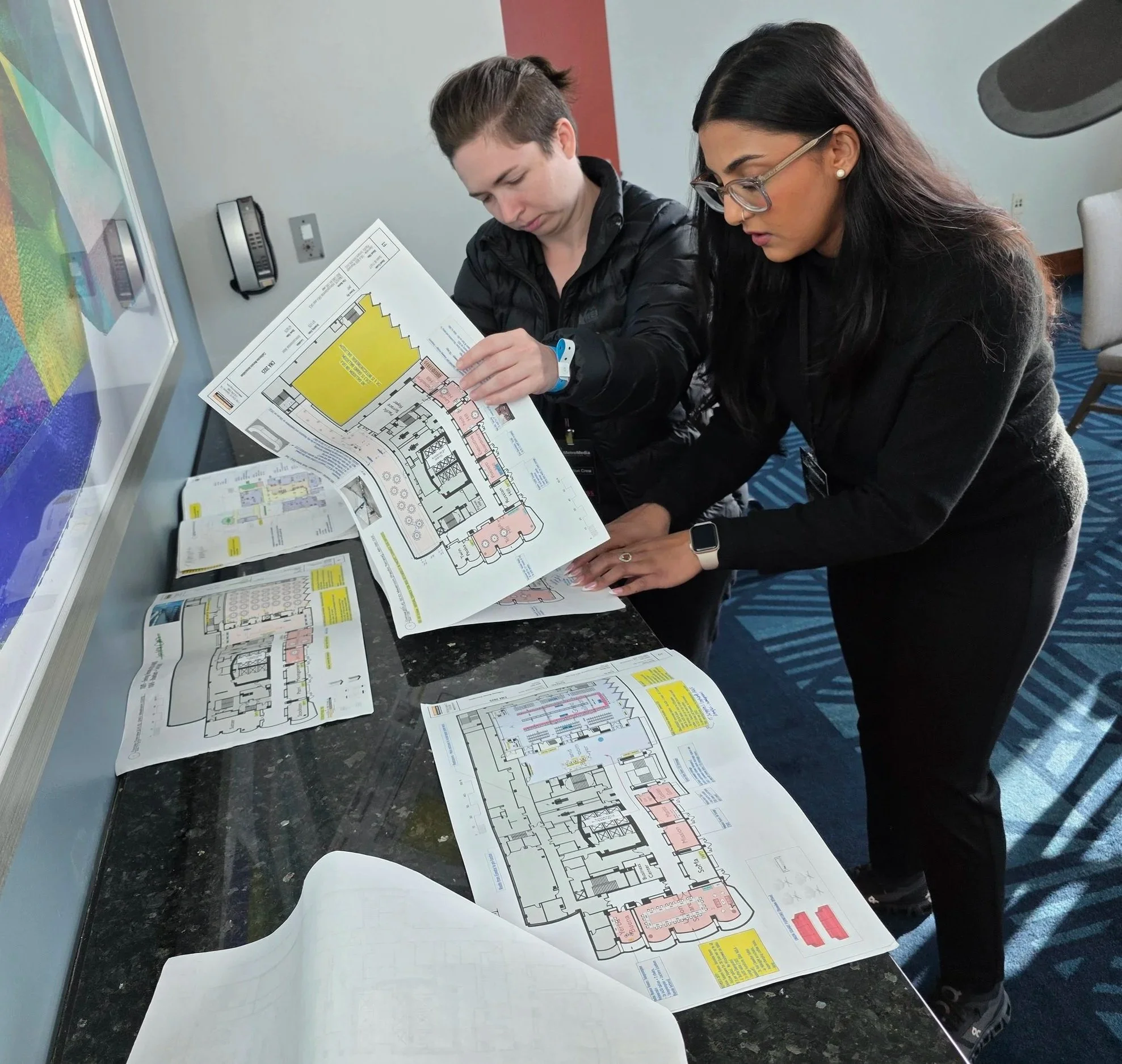 The project manager reviews paperwork with the crew.