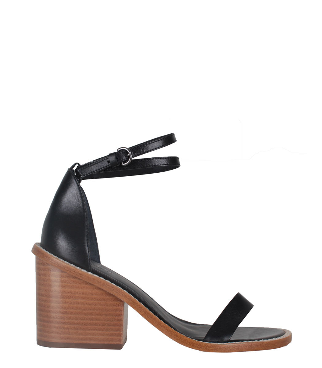  The contrast of an earthy block heel with sumptuous black leather is sleek and modern on these Tibi sandals. I think it would look smashing with this  Isabel Marant jumpsuit . Tibi sandals, $385, at  ShopBazaar .&nbsp; 