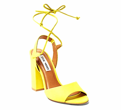  The perfect sunshine on a dreary winter's day, these yellow strappy sandals look impeccable with a  classic camel coat  and distressed boyfriend jeans rolled all the way up. Plus, when you go on vacation in December to some farflung beach resort, th
